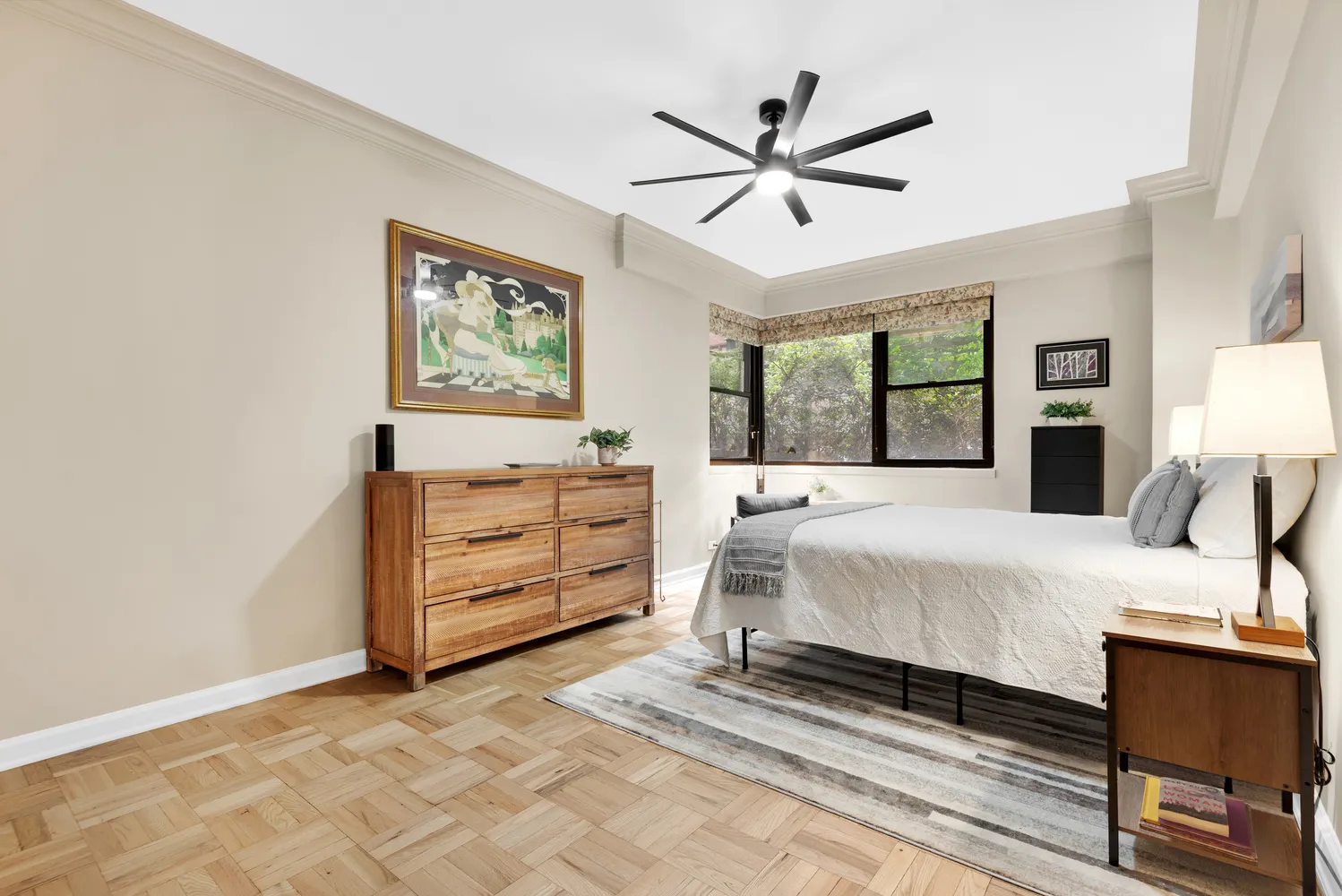 a bedroom with a bed and a dresser