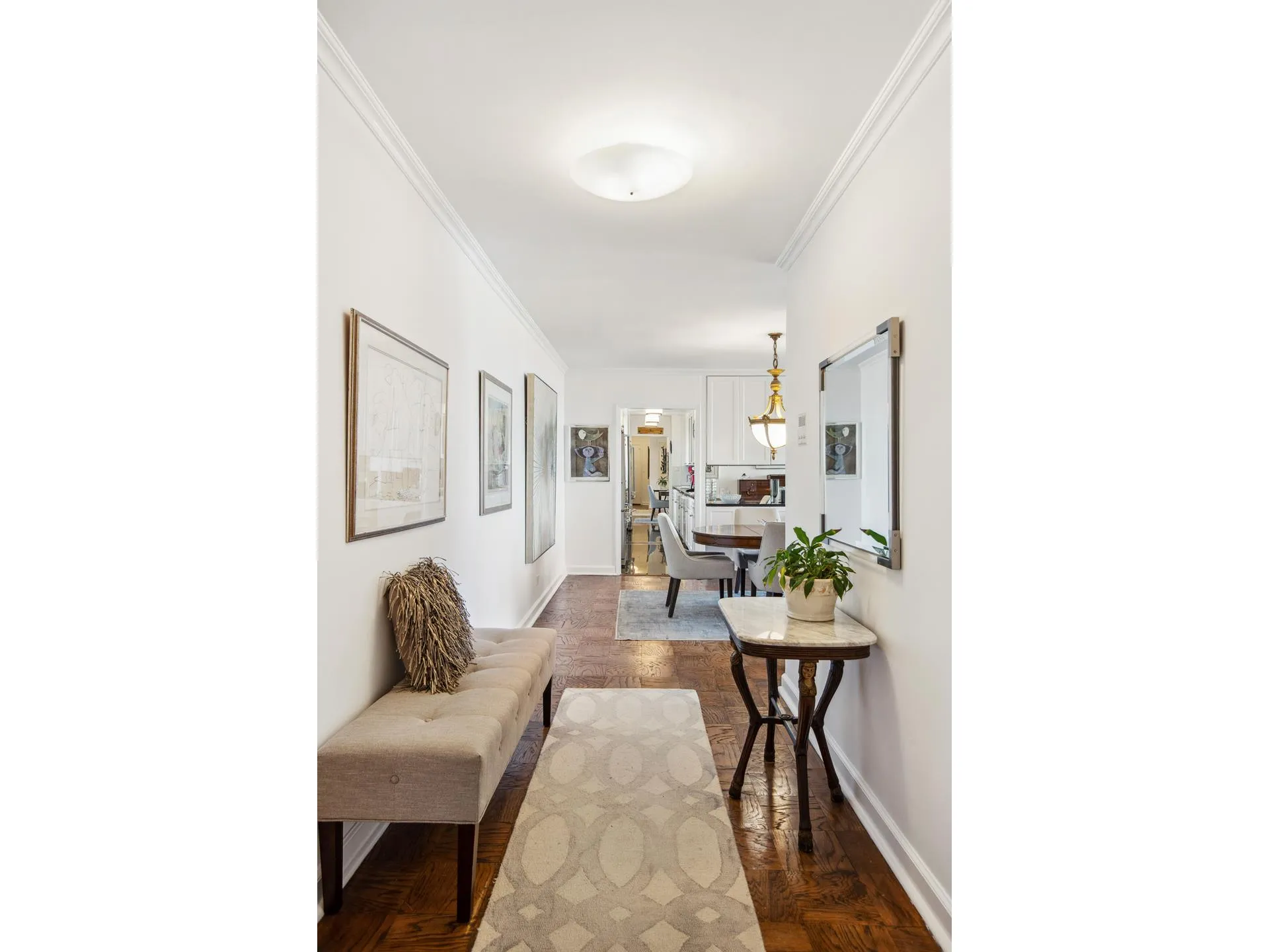 115 East 87th Street, Unit 18A Manhattan, NY 10128 - Photo 5 of 13 a living room with furniture and a table