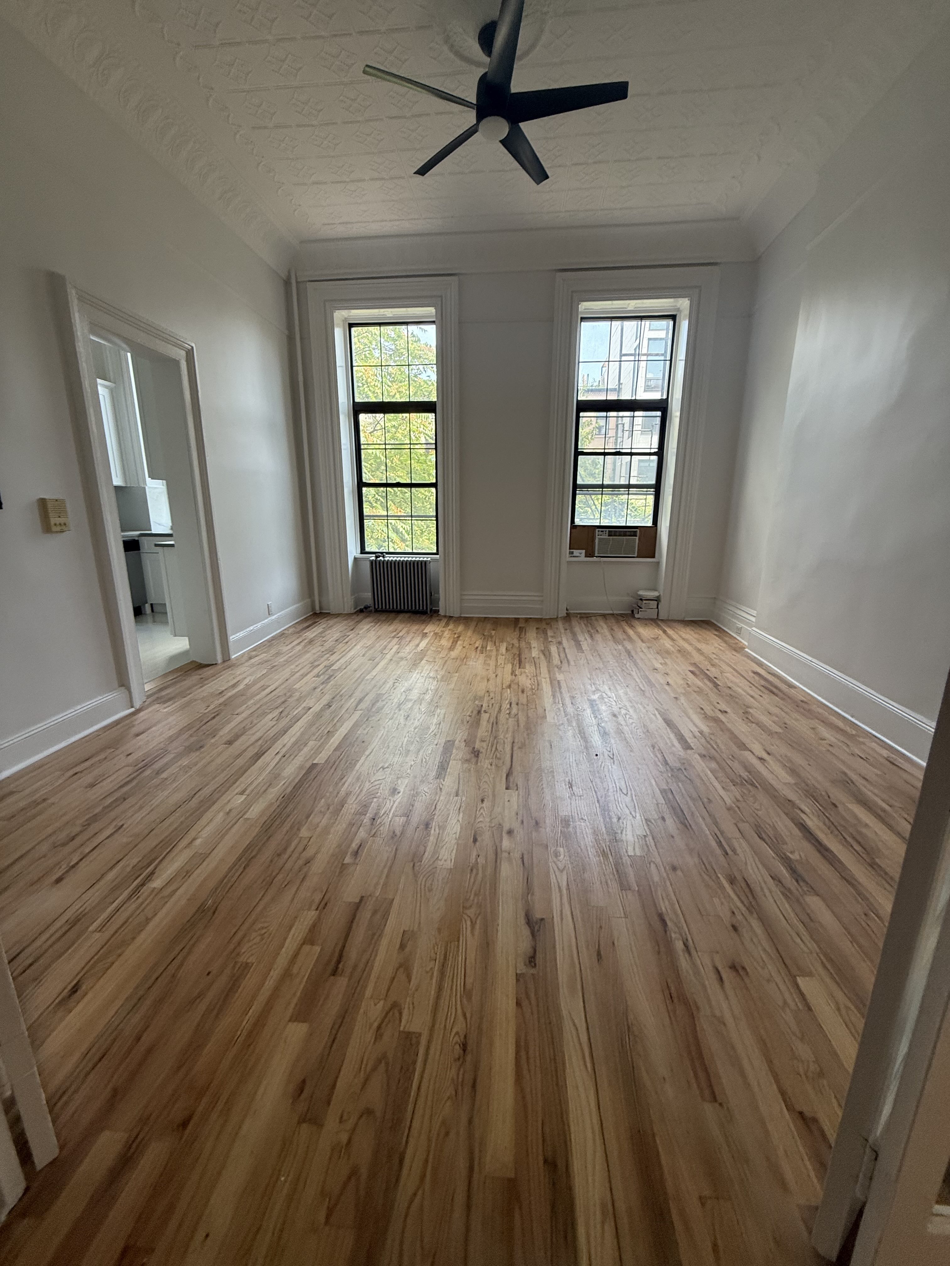 141 Summit Street, Unit 2 Brooklyn, NY 11231 - Photo 11 of 12 wooden floor in an empty room with a window