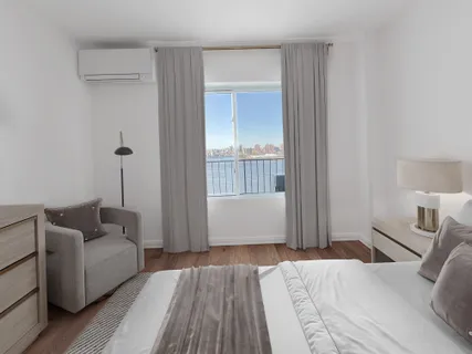 a bedroom with furniture and a wooden floor