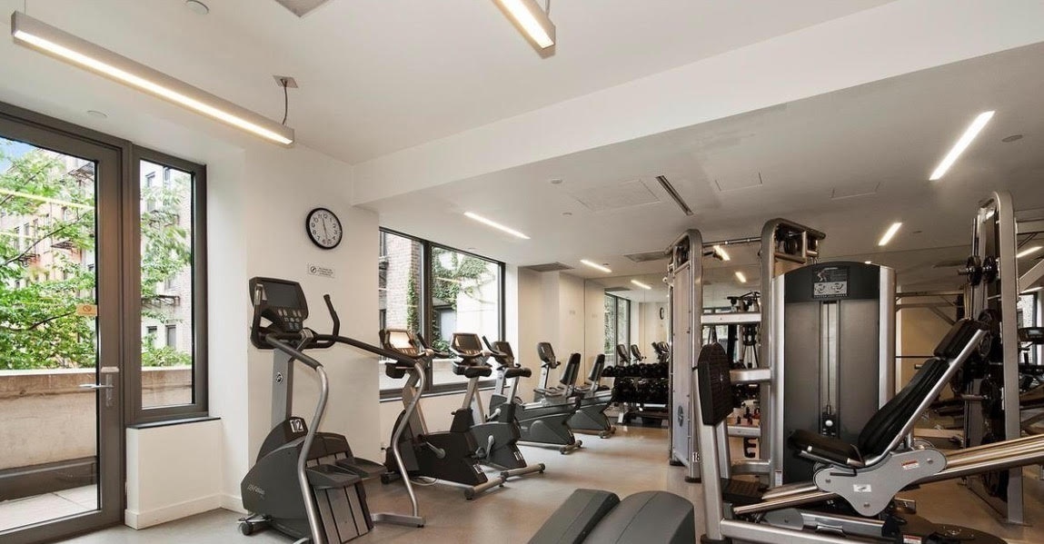 450 East 83rd Street, Unit 8B Manhattan, NY 10028 - Photo 20 of 22 a view of a room with gym equipment