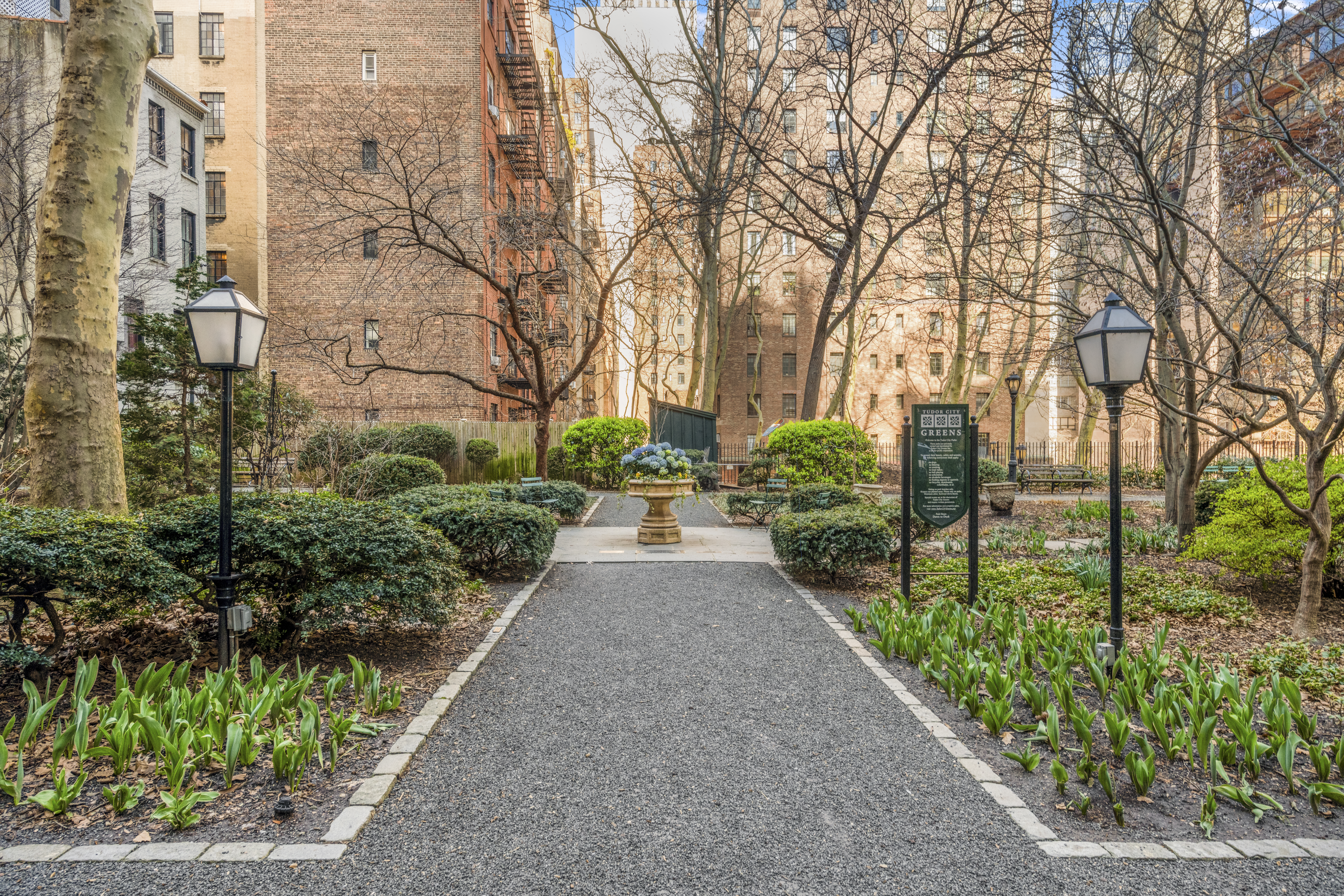 25 Tudor City Place, Unit 1419 Manhattan, NY 10017 - Photo 12 of 14 a view of a pathway with house on both side