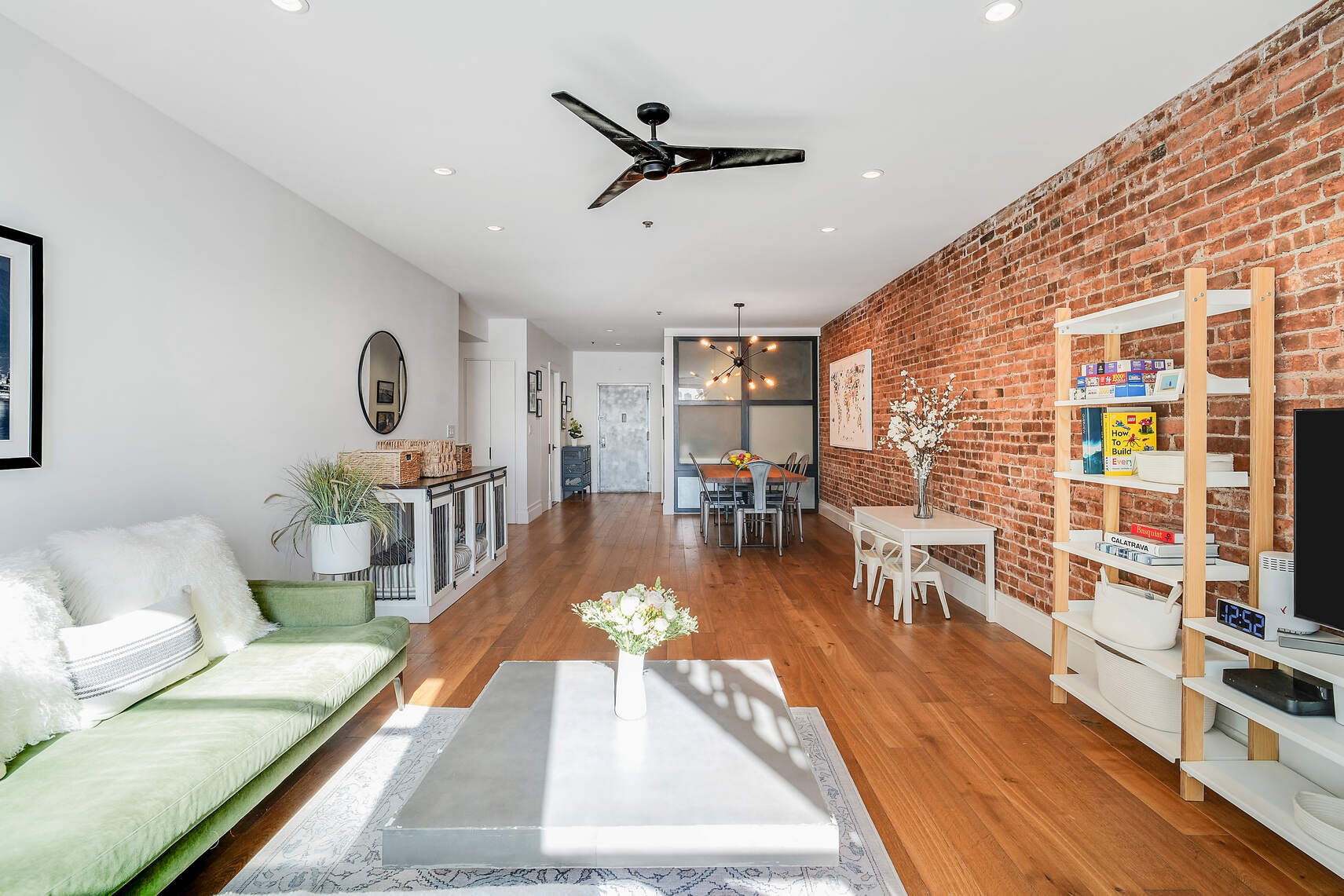 60 Pineapple Street, Unit 7I Brooklyn, NY 11201 - Photo 3 of 14 a living room with furniture and a wooden floor