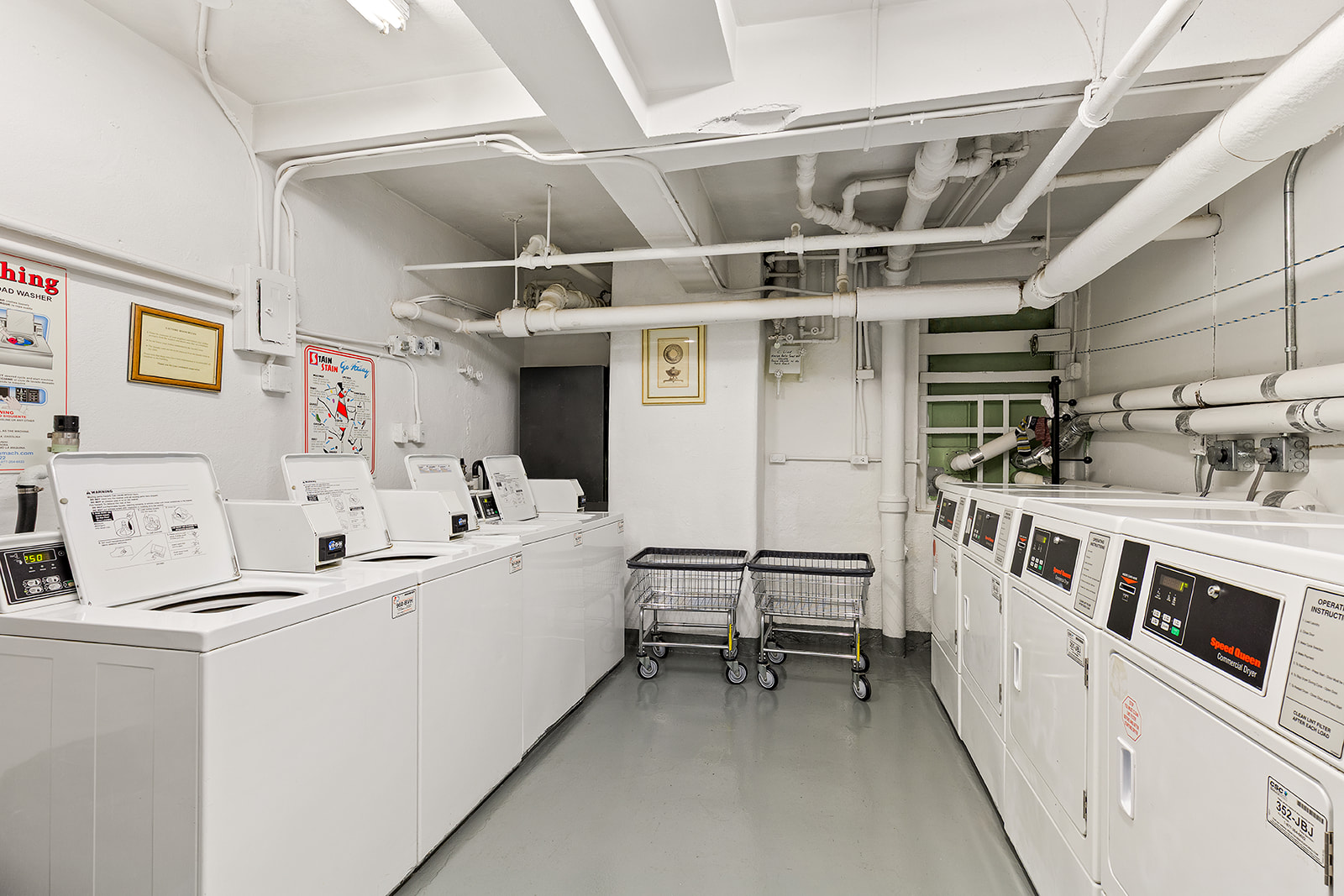 71 East 77th Street, Unit 8A Manhattan, NY 10075 - Photo 8 of 9 a utility room with dryer and washer