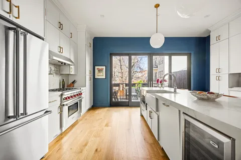 a kitchen with stainless steel appliances a stove oven and a refrigerator