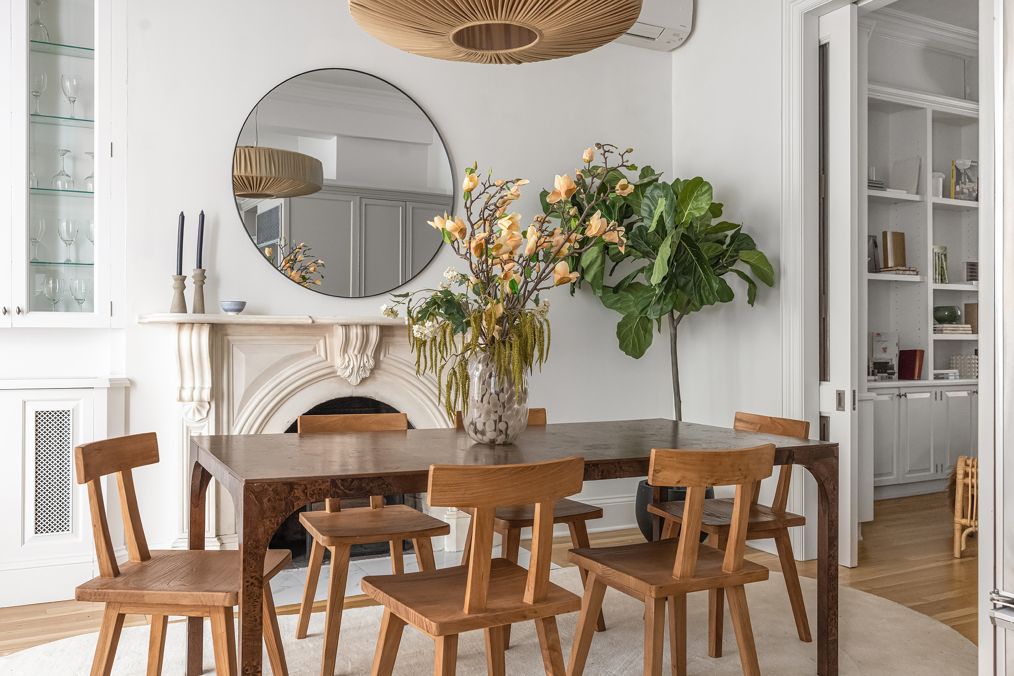 112 West 13th Street Manhattan, NY 10011 - Photo 13 of 46 a dining room with furniture potted plants and a fireplace