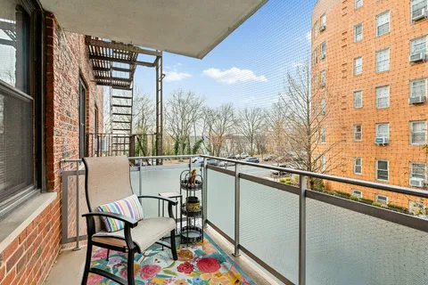 a view of a balcony with chairs