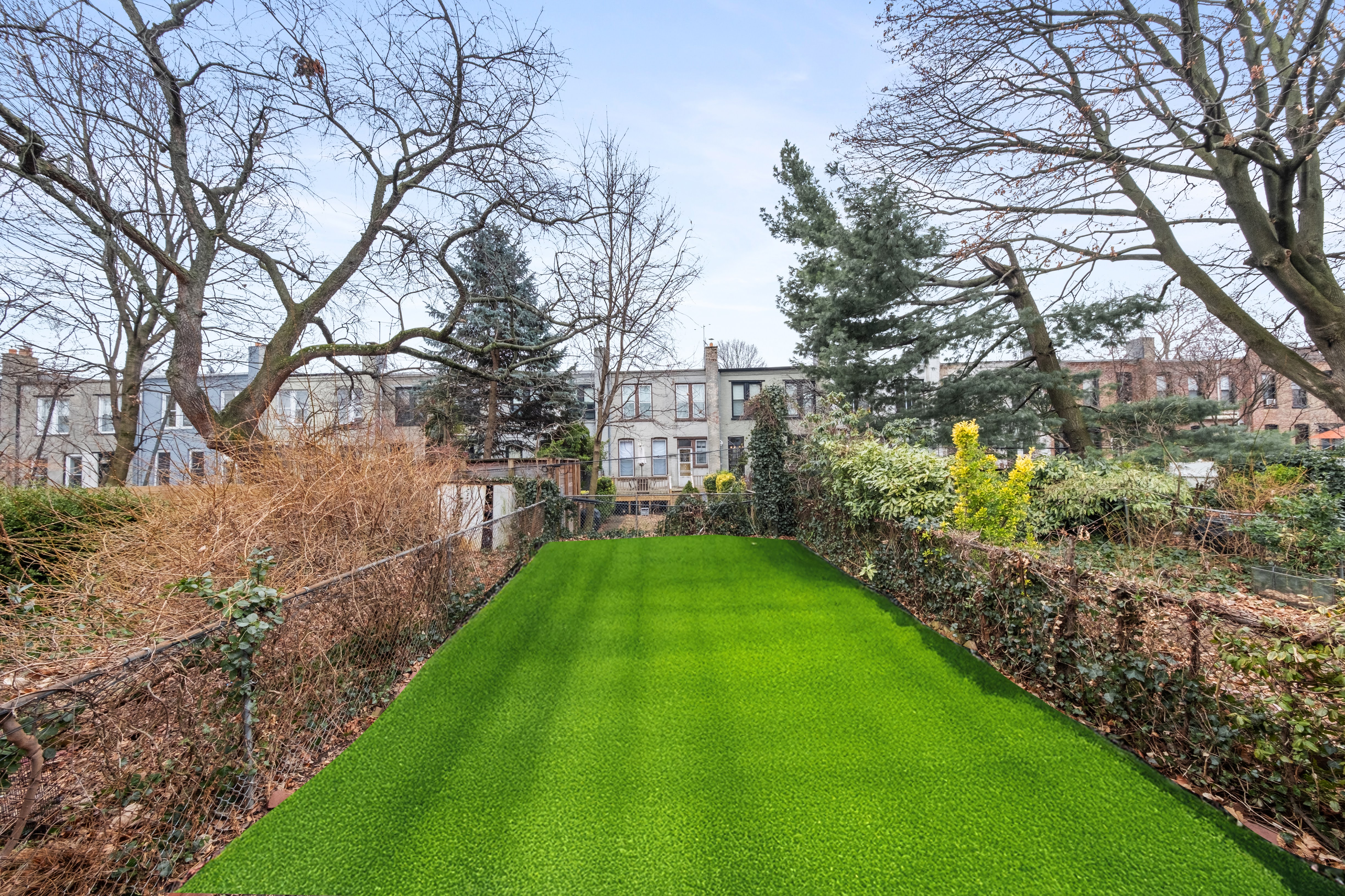 196 Maple Street Brooklyn, NY 11225 - Photo 24 of 31 a view of a yard with plants and large trees