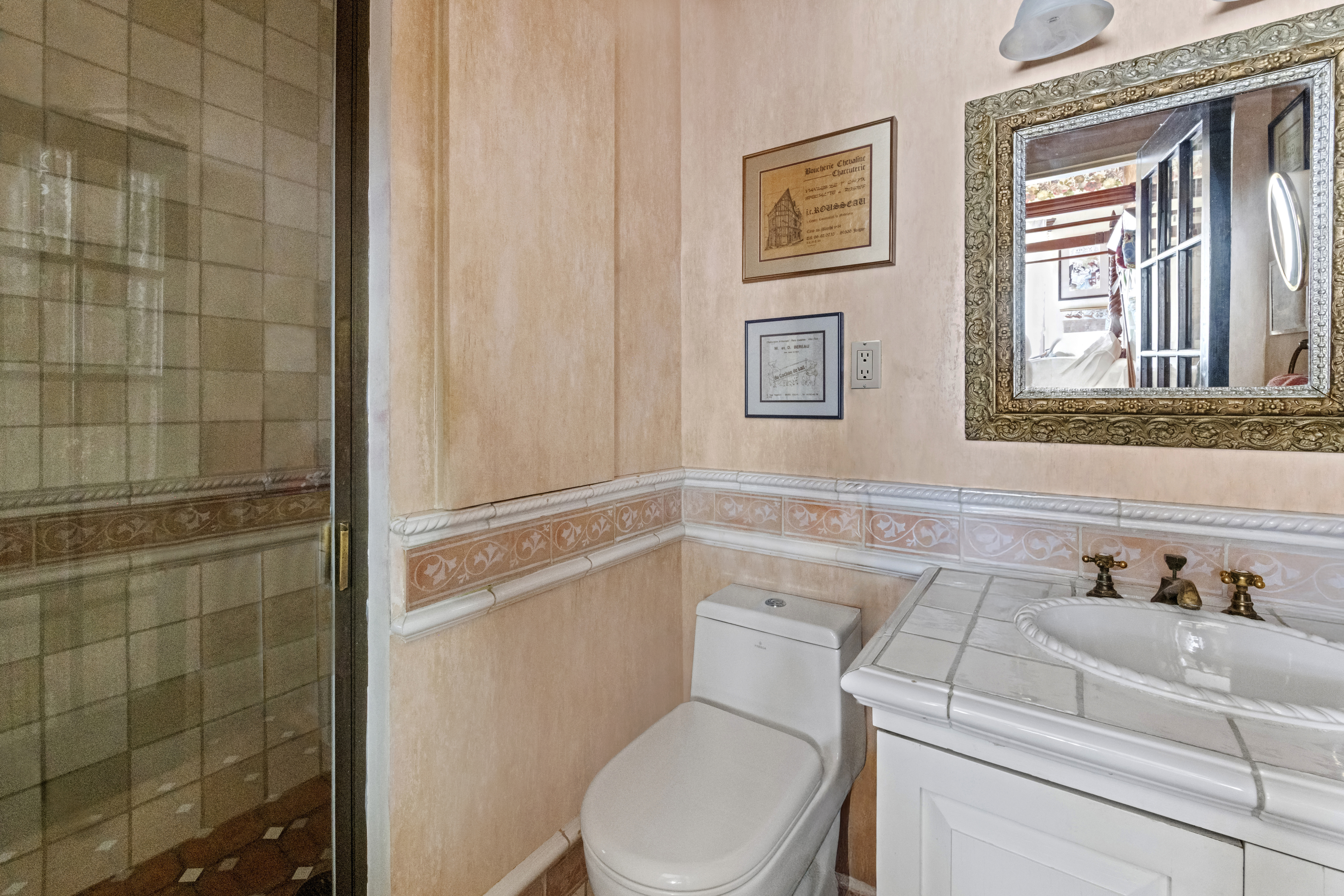 228 West 21st Street, Unit 2 Manhattan, NY 10011 - Photo 9 of 14 a white toilet sitting next to a bathroom sink
