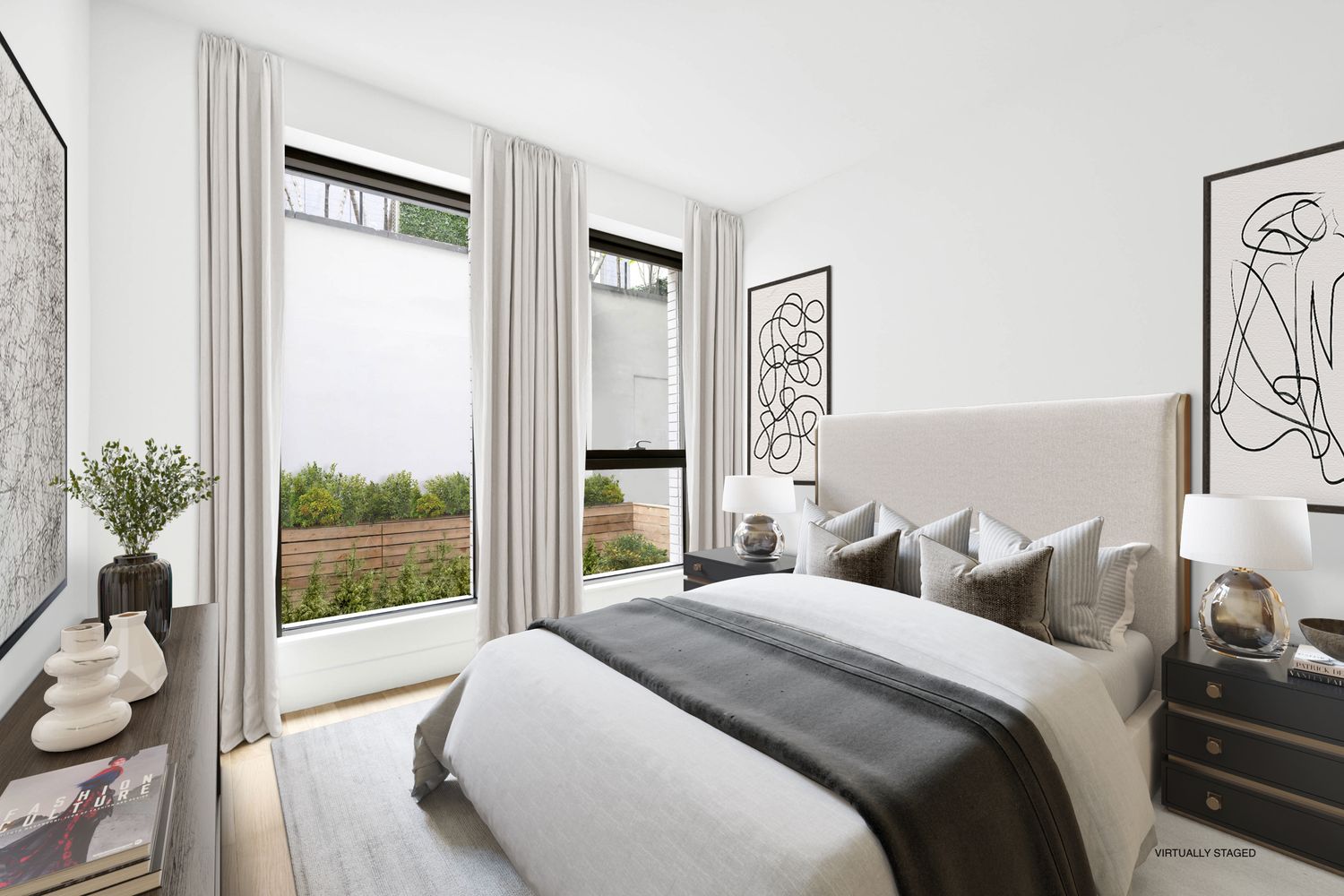 a bedroom with a large bed and a large window