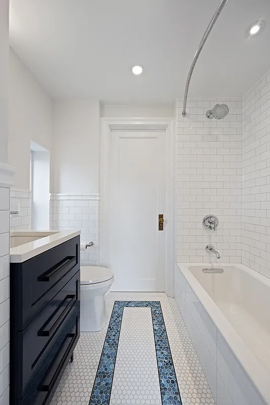 415 Central Park West, Unit 6A Manhattan, NY 10025 - Photo 22 of 25 a bathroom with a sink a toilet and shower