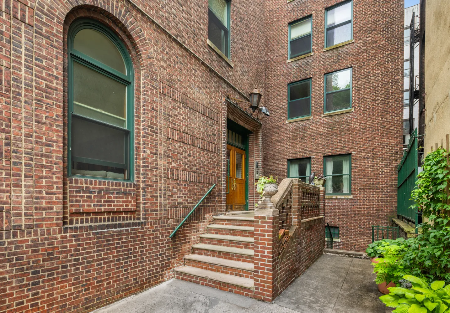 a view of front door of house with stairs