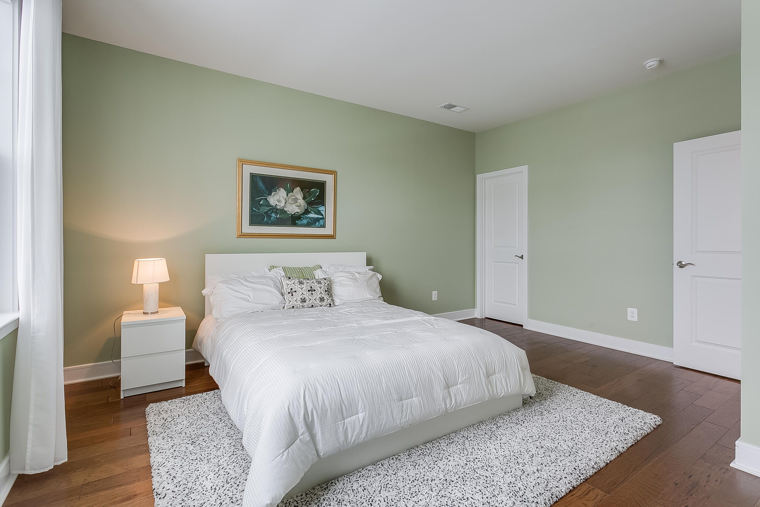 1011 Justinian Street Leesburg, VA 20175 - Photo 35 of 56 a bedroom with a bed and a night stand