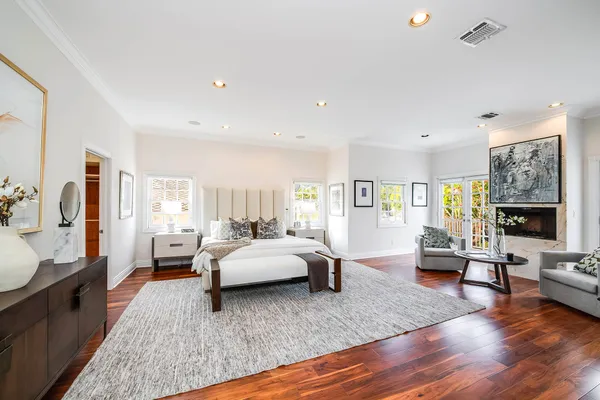 a living room with furniture window and wooden floor
