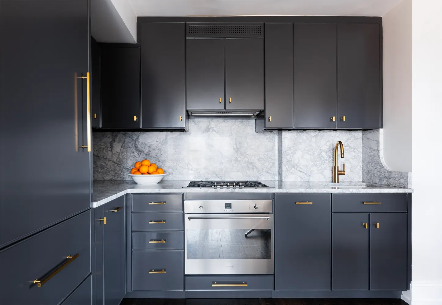 a kitchen with granite countertop cabinets and stainless steel appliances