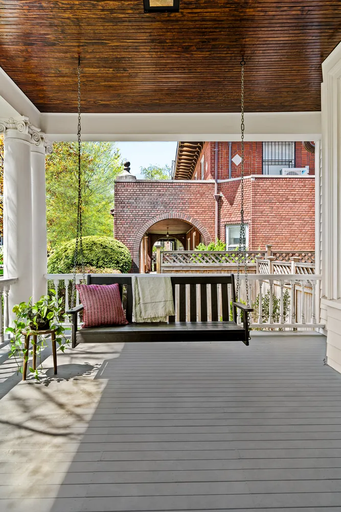 a view of balcony with furniture