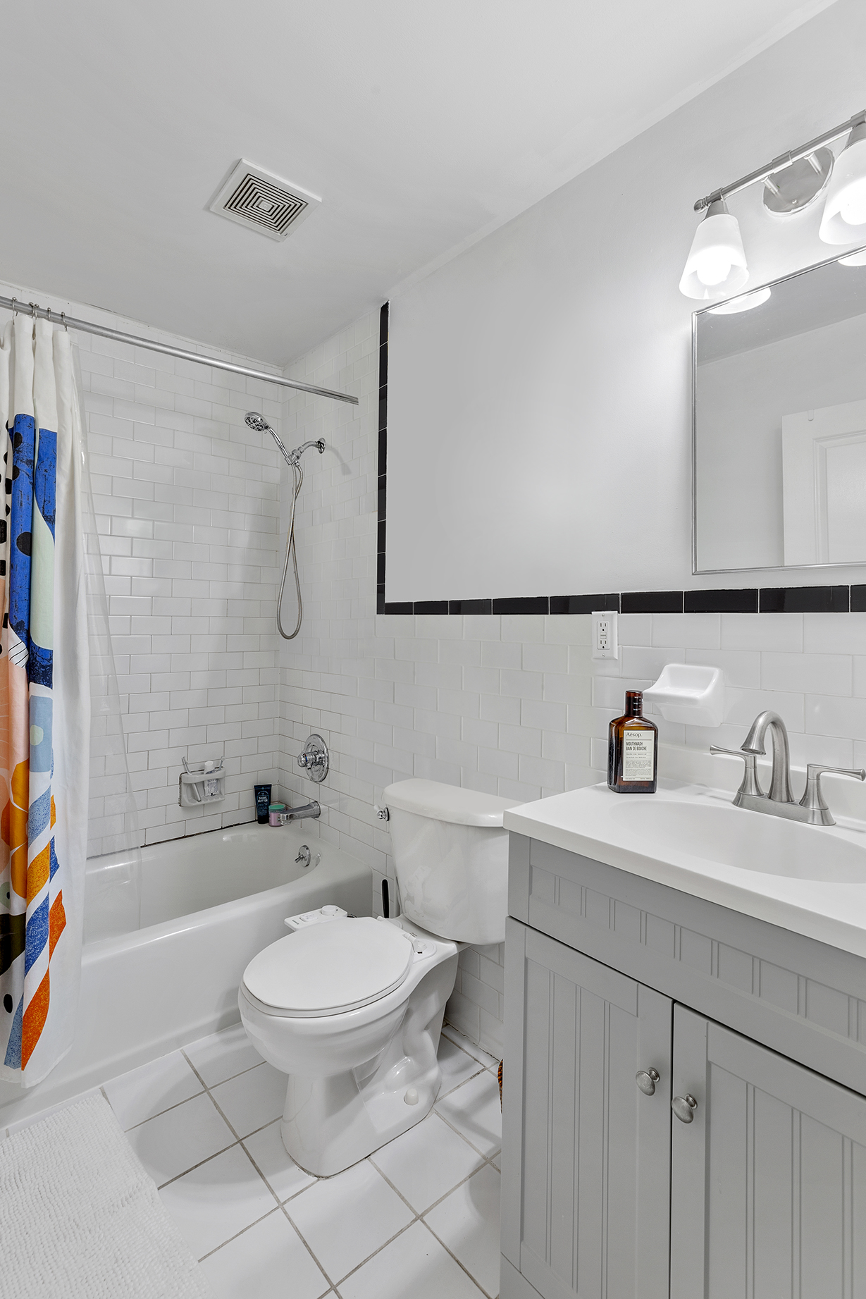 232 Monroe Street Brooklyn, NY 11216 - Photo 19 of 21 a bathroom with a sink a toilet and shower