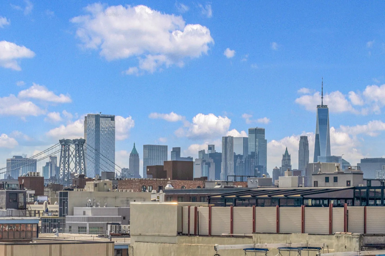 a view of a city with tall buildings