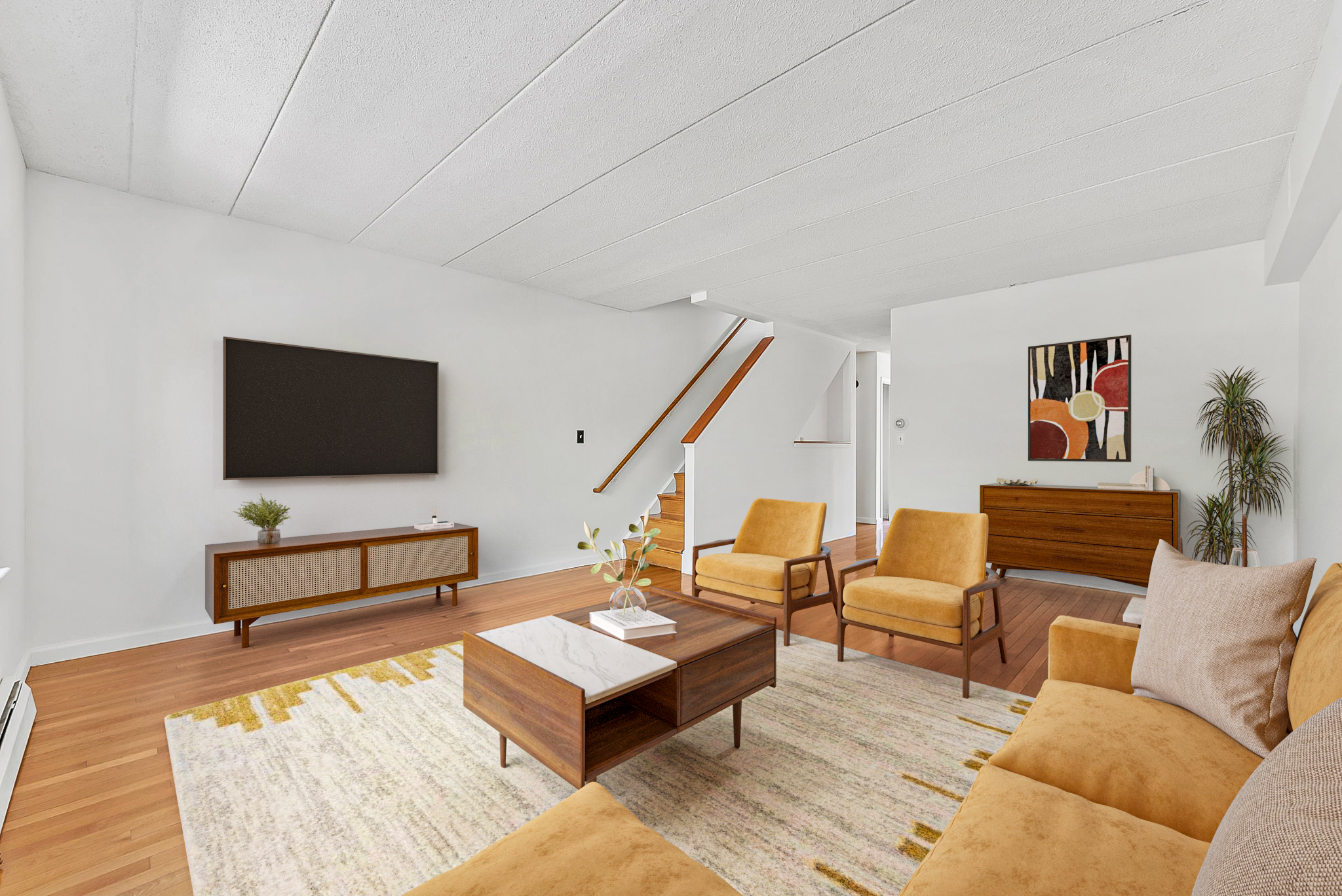 2573 Frederick Douglass Boulevard, Unit D Manhattan, NY 10030 - Photo 3 of 13 a living room with furniture and a flat screen tv