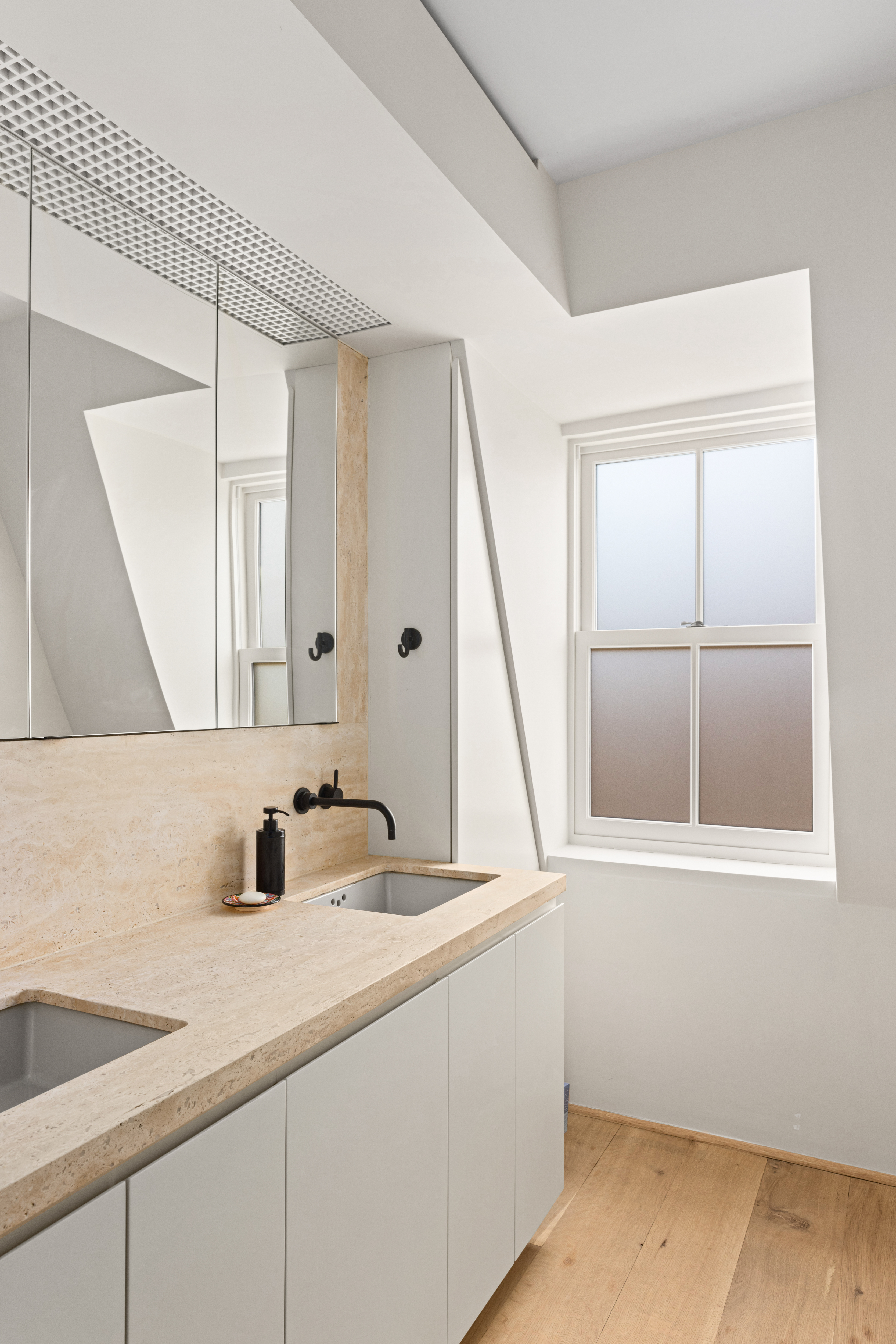 159 Hoyt Street Brooklyn, NY 11217 - Photo 7 of 18 a bathroom with a sink and a window