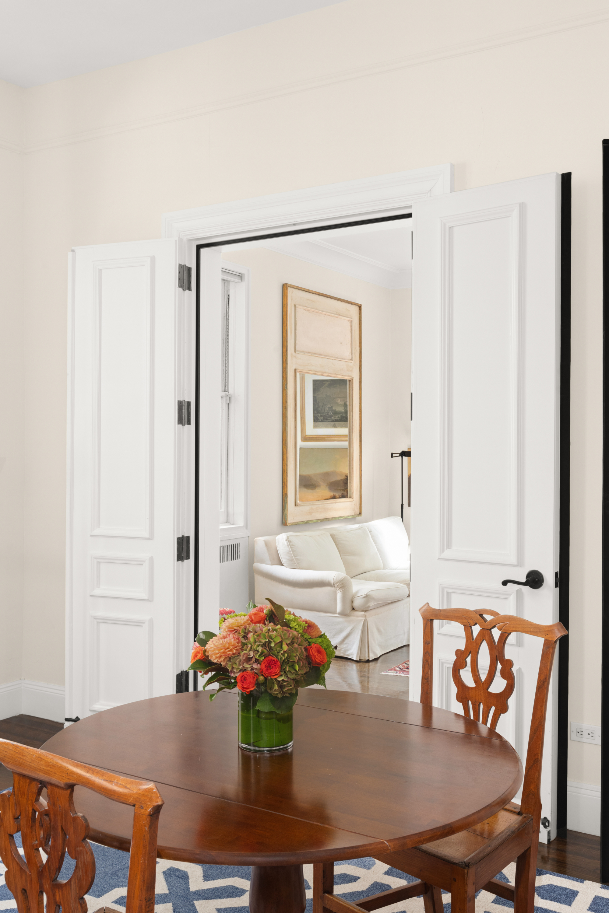 51 East 78th Street, Unit 3BC Manhattan, NY 10075 - Photo 14 of 25 a view of a dining room with furniture and wooden floor