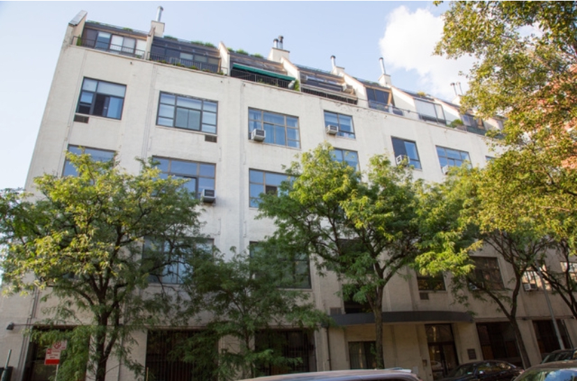 130 Barrow Street, Unit 302 Manhattan, NY 10014 - Photo 10 of 11 a view of a building with a tree