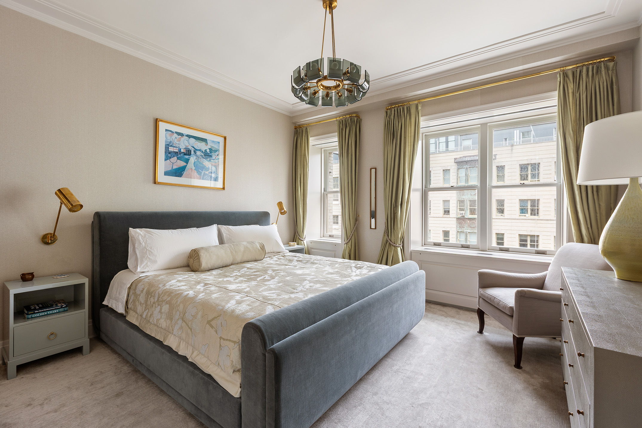 225 West 86th Street, Unit 1005 Manhattan, NY 10024 - Photo 7 of 15 a bedroom with a bed and a chandelier