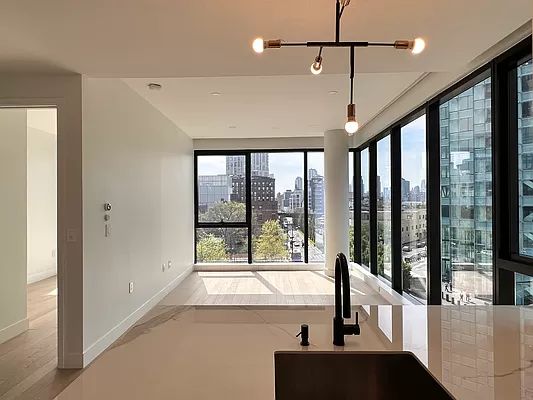 4507 Court Square, Unit 8D Queens, NY 11101 - Photo 21 of 28 a view of a living room and hardwood floor