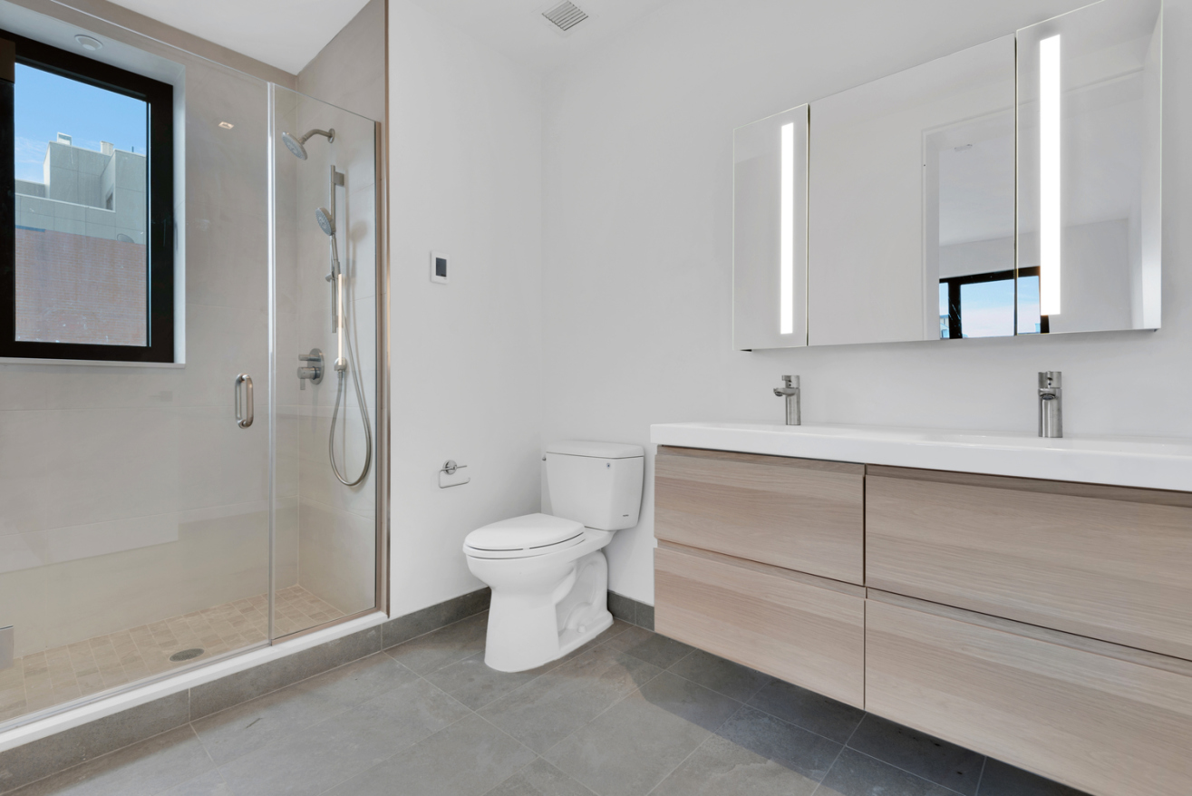 888 Lorimer Street, Unit 4 Brooklyn, NY 11222 - Photo 10 of 13 a bathroom with a sink and a mirror