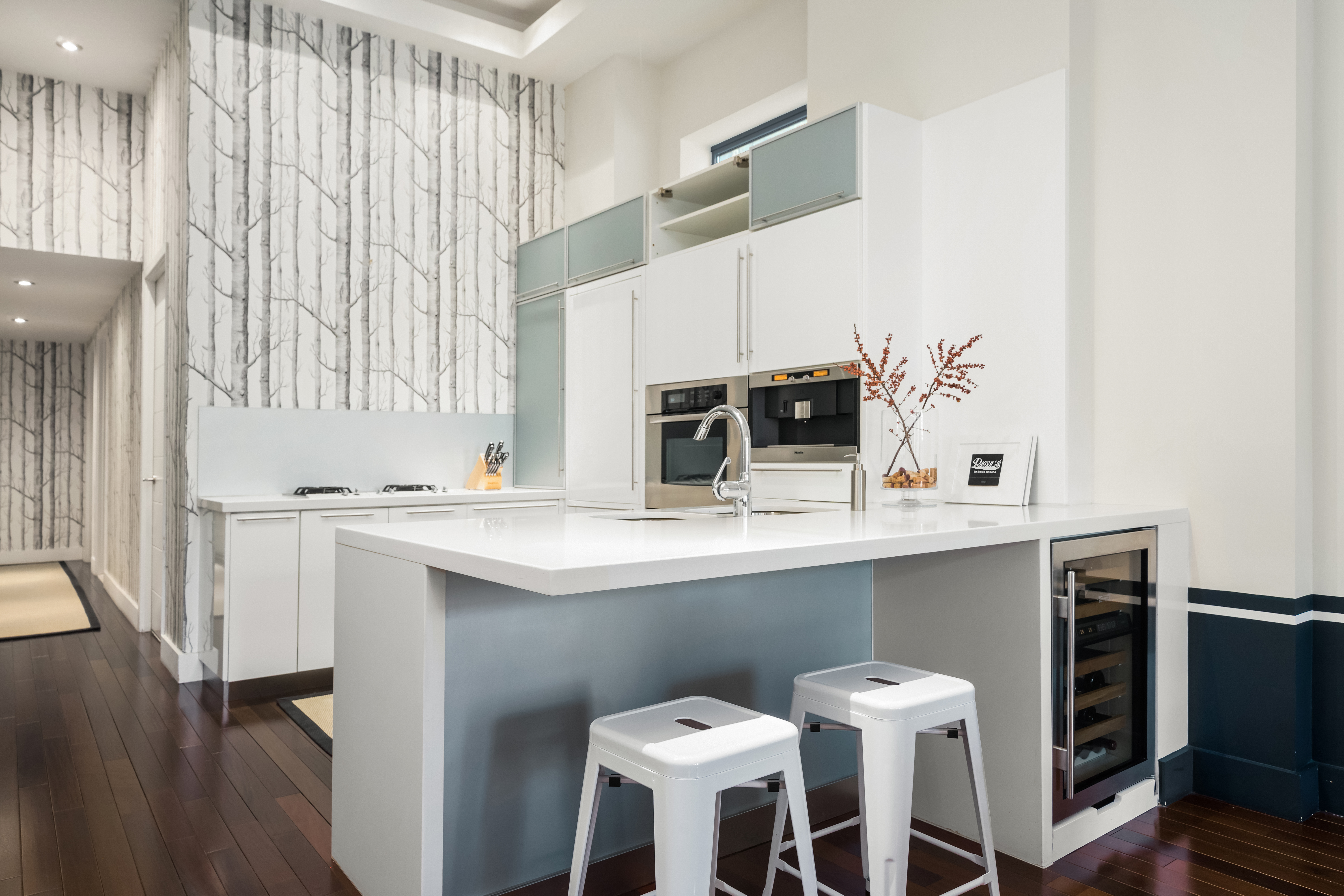 92 Greene Street, Unit 3B Manhattan, NY 10012 - Photo 3 of 8 a kitchen with a sink and chairs