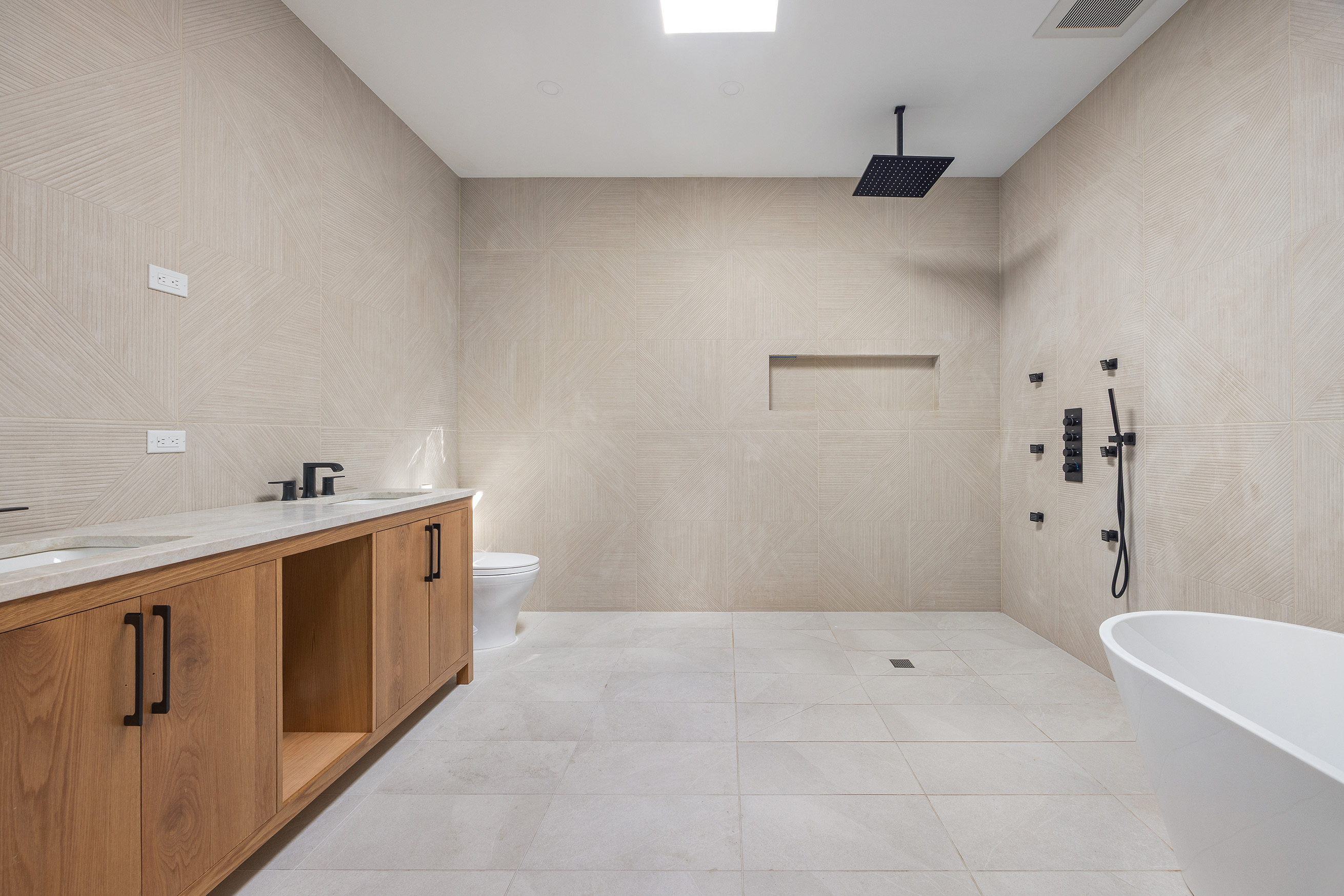 1423 Park Place Brooklyn, NY 11213 - Photo 13 of 17 a spacious bathroom with a tub sink and mirror