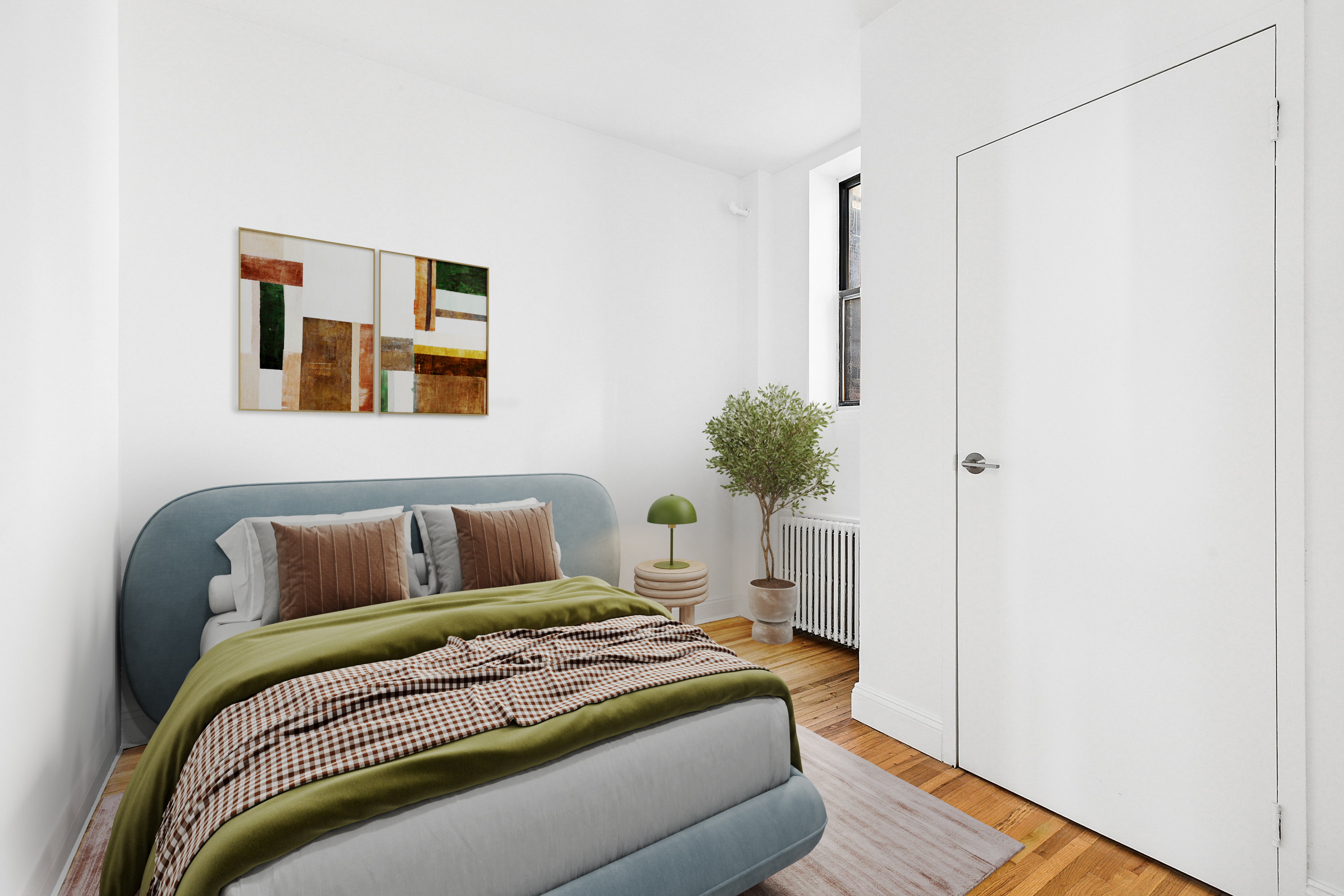 643 9th Avenue, Unit 4A Manhattan, NY 10036 - Photo 4 of 5 a bedroom with a bed and a potted plant