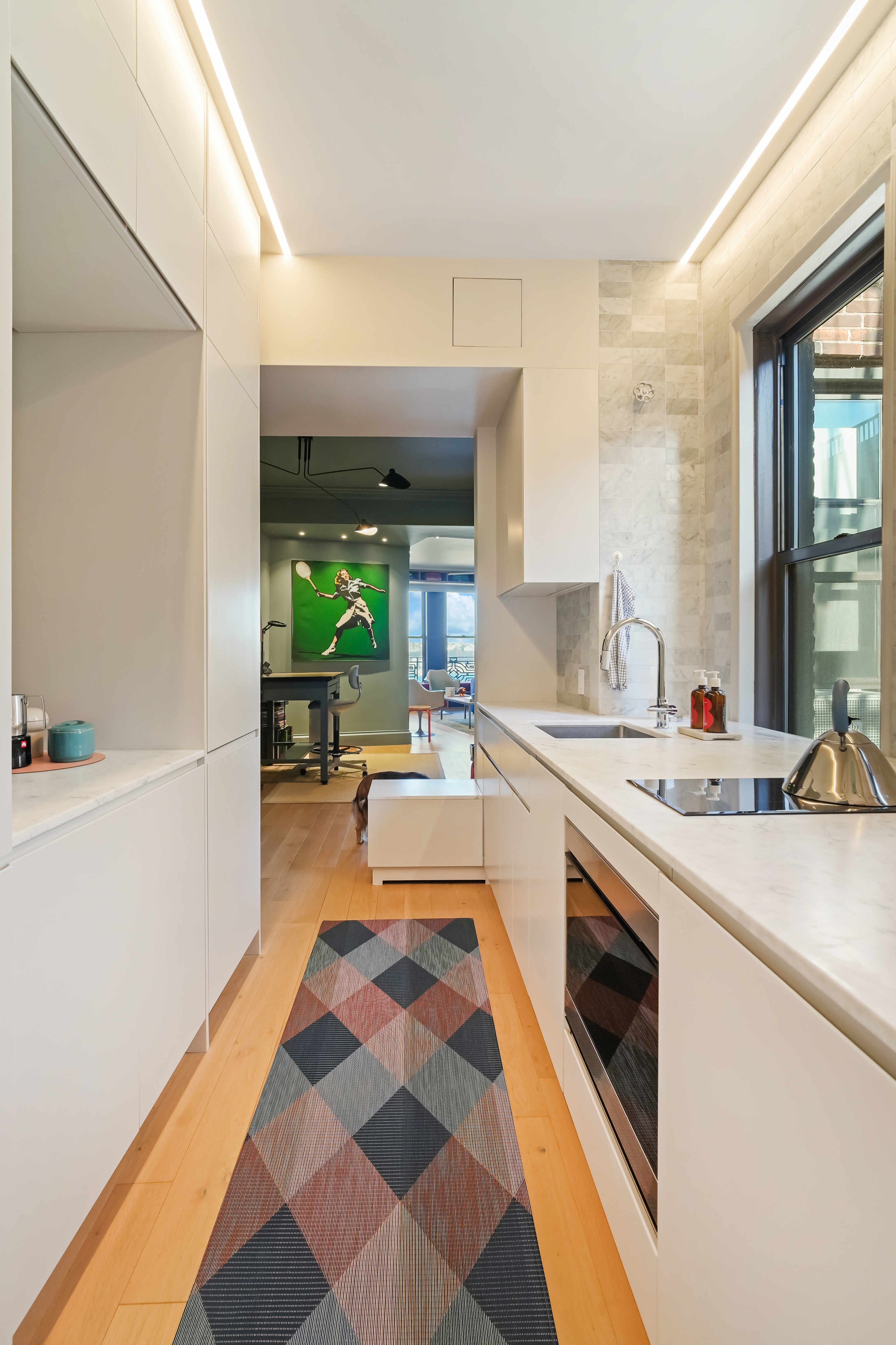 265 Riverside Drive, Unit 11F Manhattan, NY 10025 - Photo 11 of 18 a large white kitchen with a stove a sink and a refrigerator