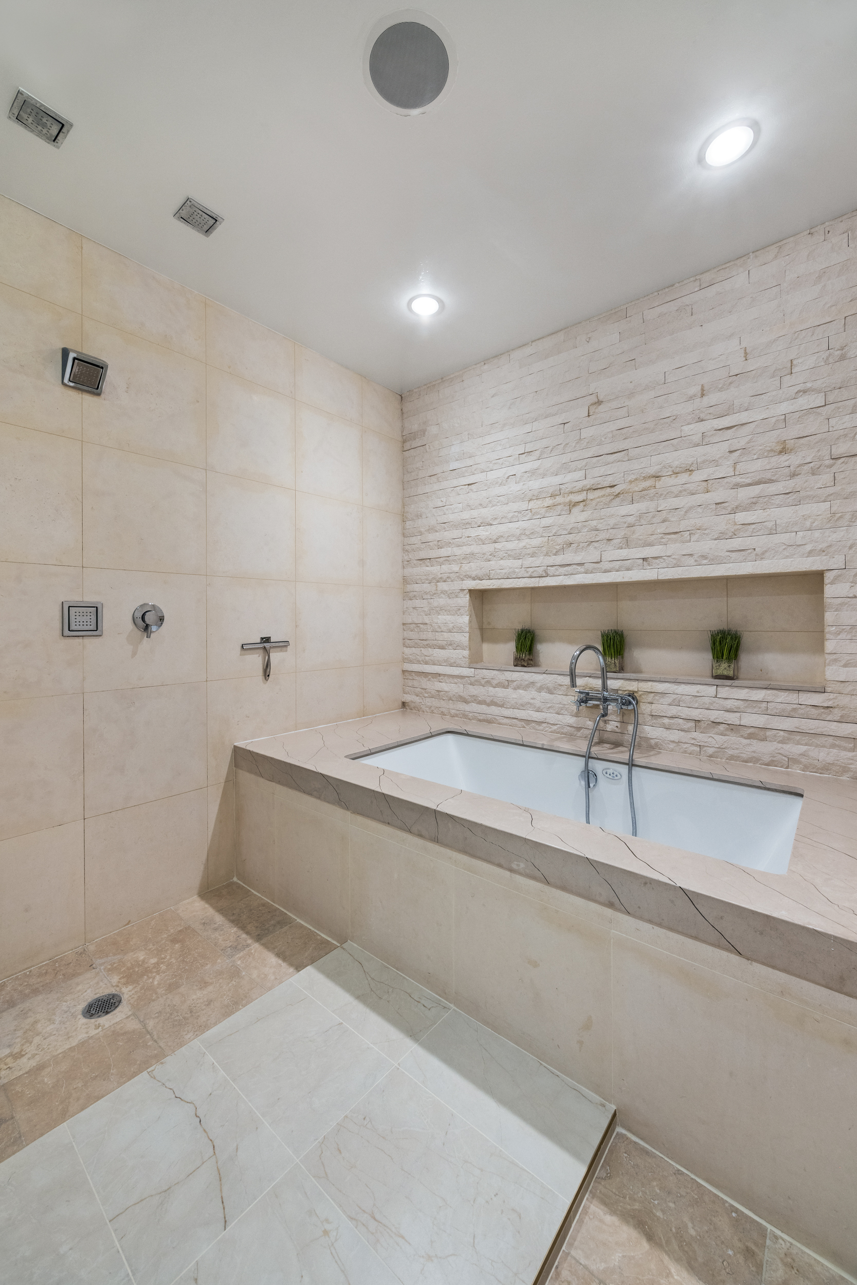 157 East 84th Street, Unit THA Manhattan, NY 10028 - Photo 22 of 33 a bathroom with a tub and a sink