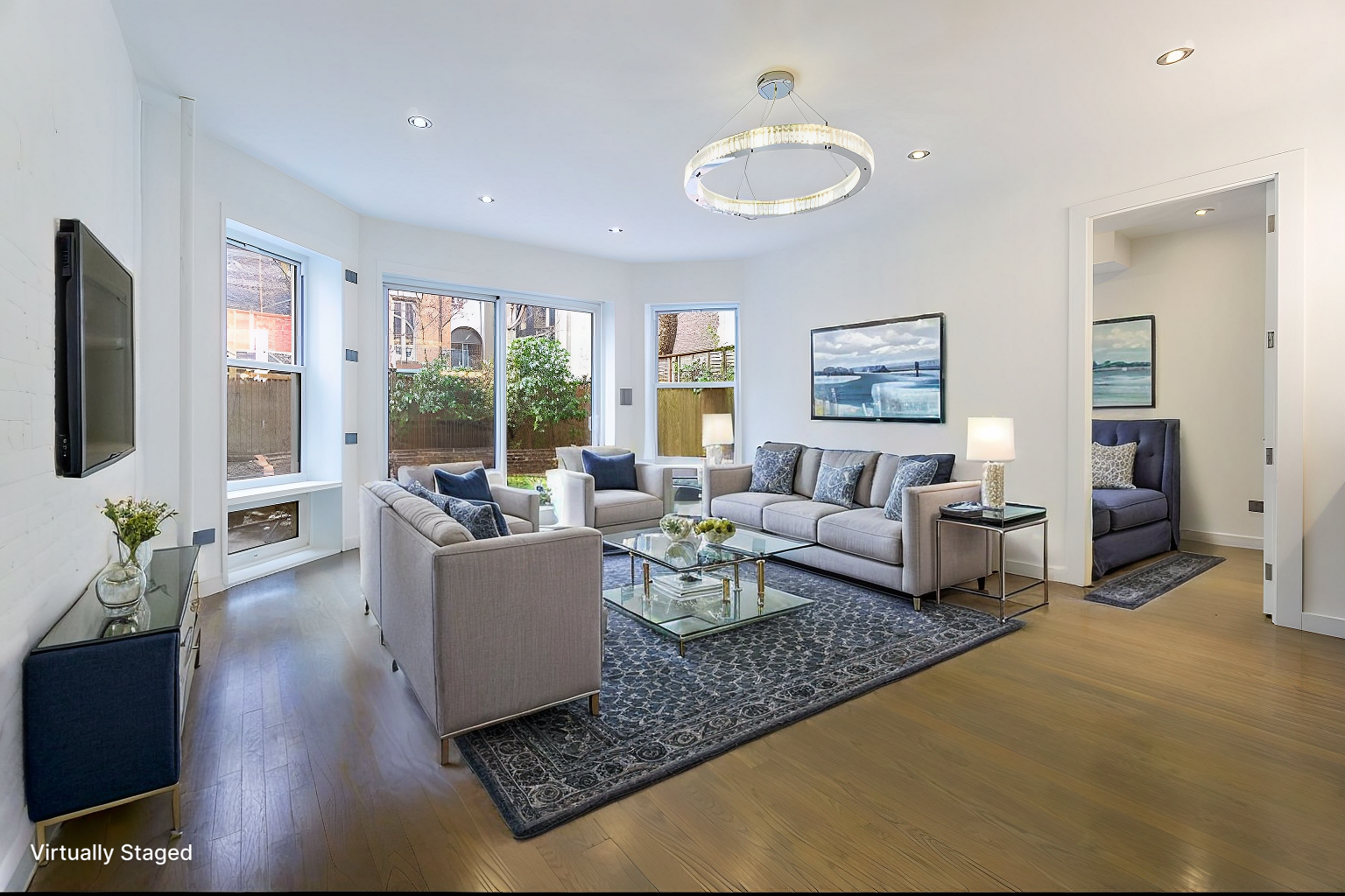 a living room with furniture and a flat screen tv