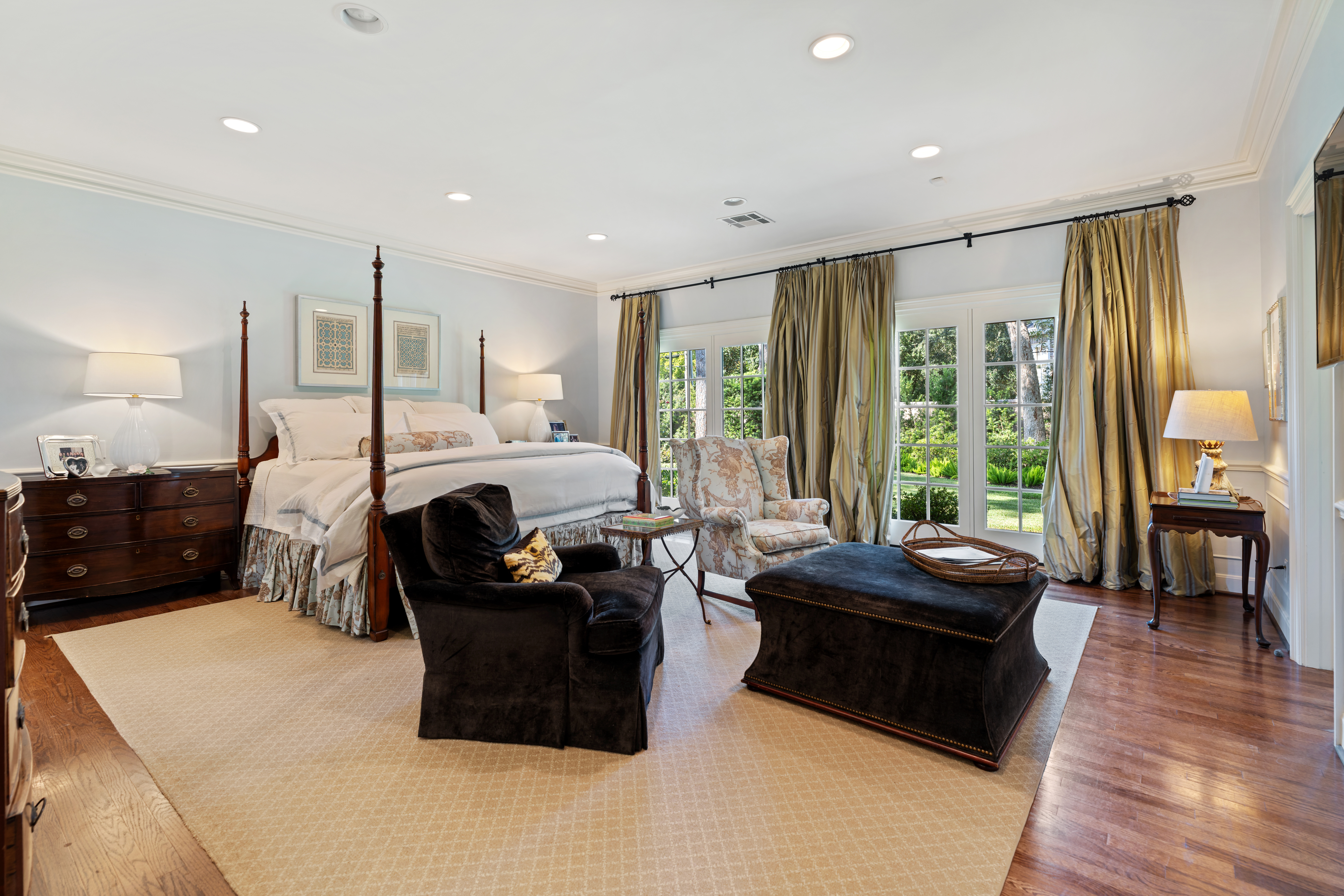 711 Pifer Road Houston, TX 77024 - Photo 26 of 53 a bedroom with a bed and large windows