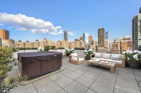 a view of a terrace with sitting area