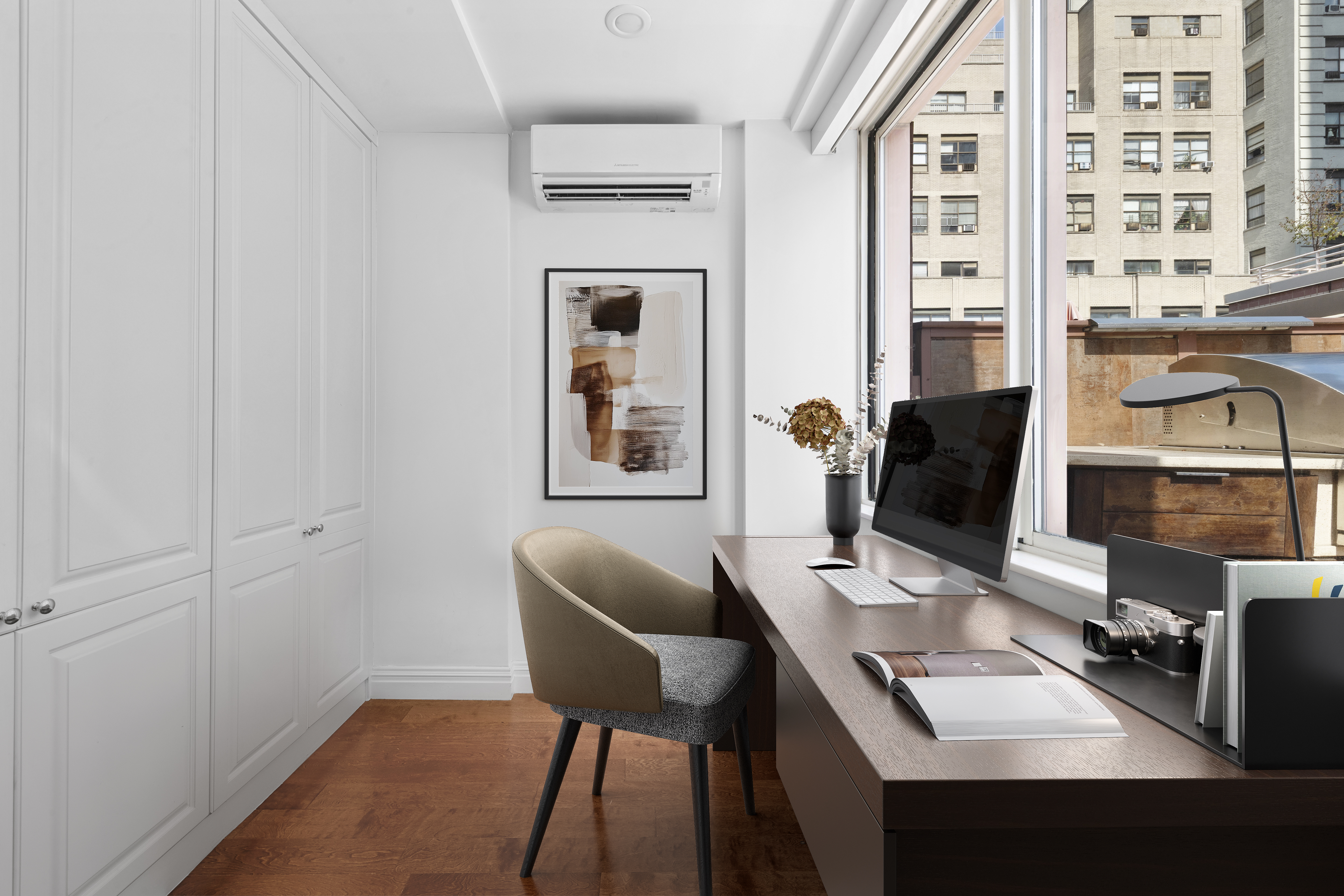 393 West 49th Street, Unit 5NN Manhattan, NY 10019 - Photo 11 of 13 a work room with furniture and wooden floor