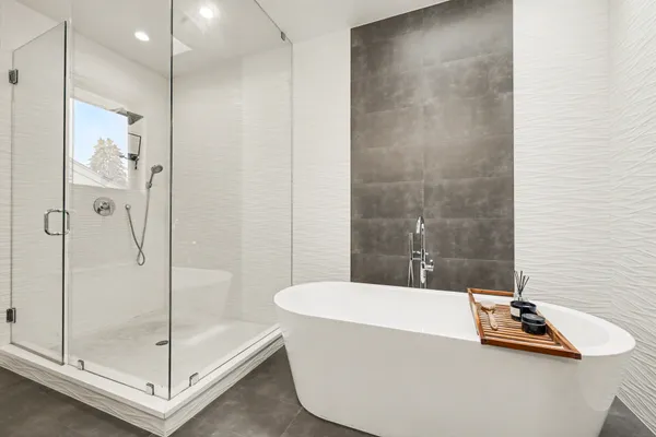 a bathroom with a tub and shower