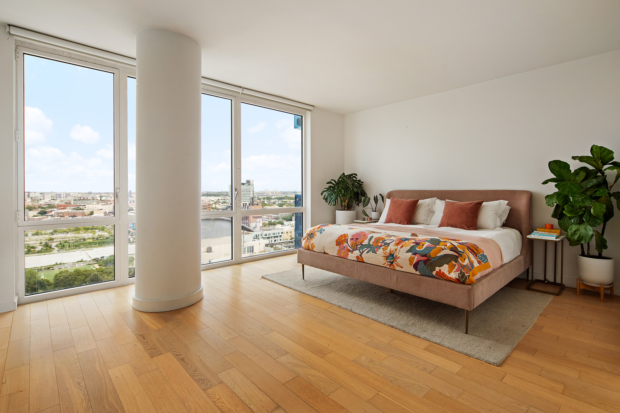 22 North 6th Street, Unit 24F Brooklyn, NY 11249 - Photo 2 of 16 a bedroom with a large bed and a large window