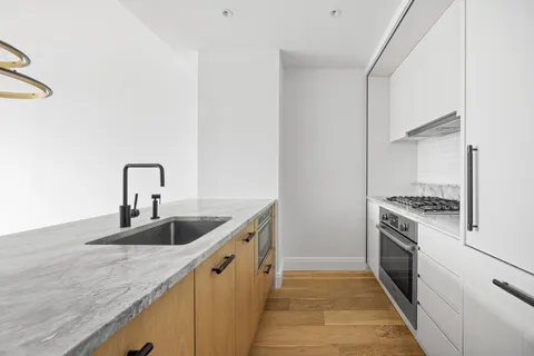 a kitchen with a sink and a stove