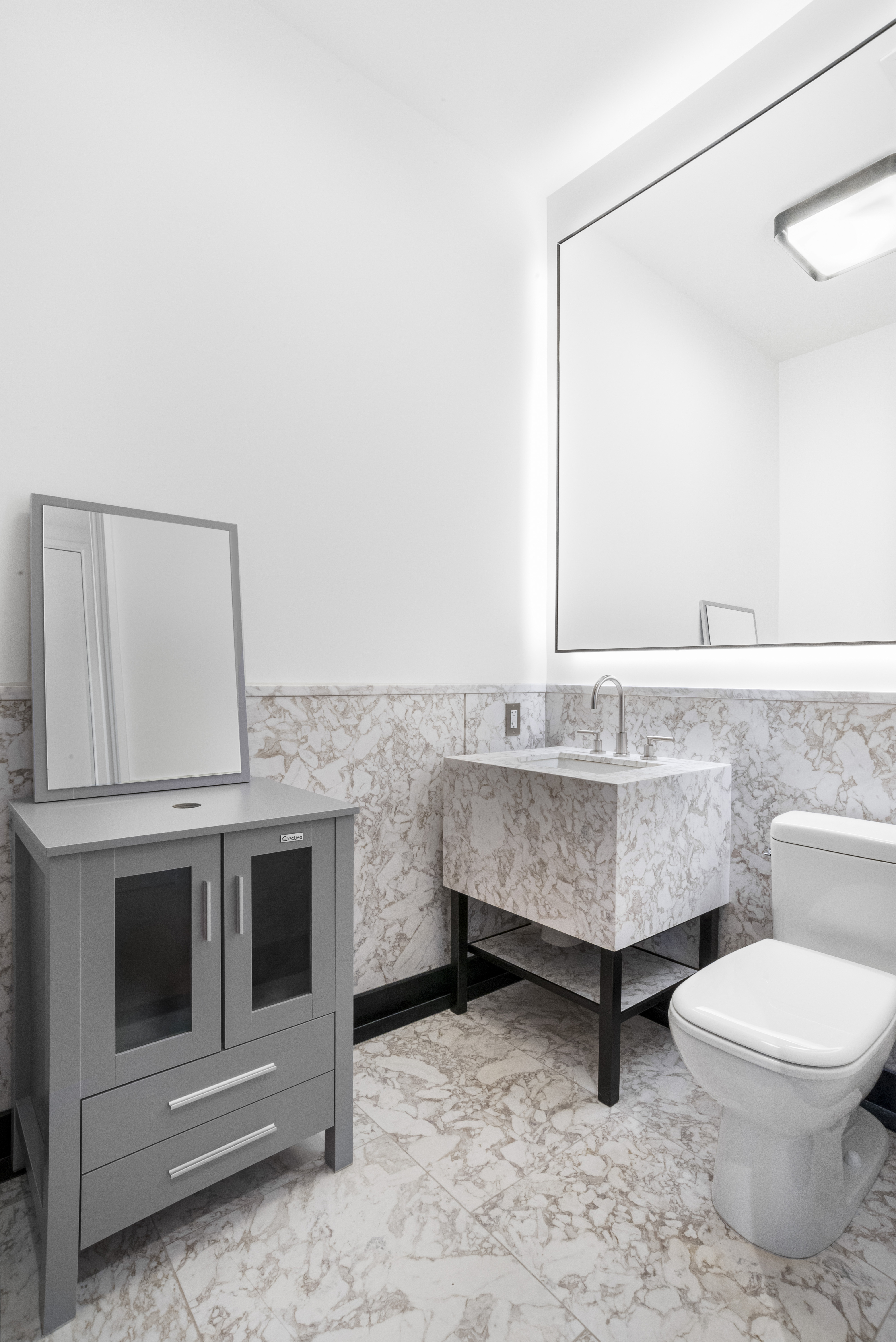 15 East 30th Street, Unit Undisclosed Manhattan, NY 10016 - Photo 11 of 23 a bathroom with a sink toilet and mirror