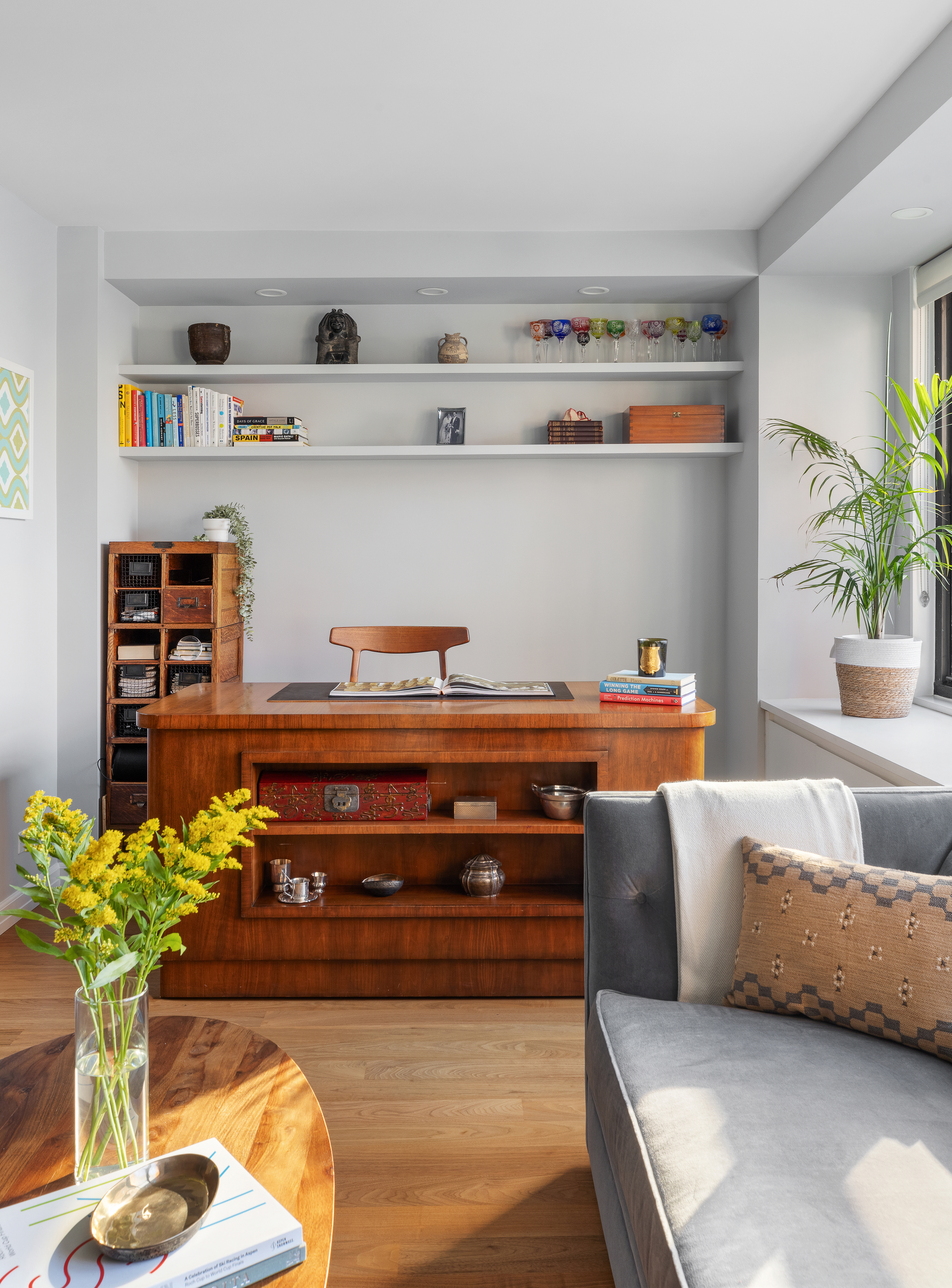 225 East 57th Street, Unit 9M Manhattan, NY 10022 - Photo 3 of 10 a living room with furniture and potted plant