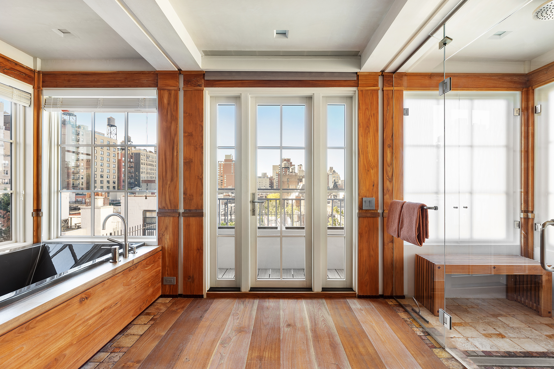 428 Columbus Avenue, Unit PH Manhattan, NY 10024 - Photo 12 of 21 a large space with a large window and wooden floor