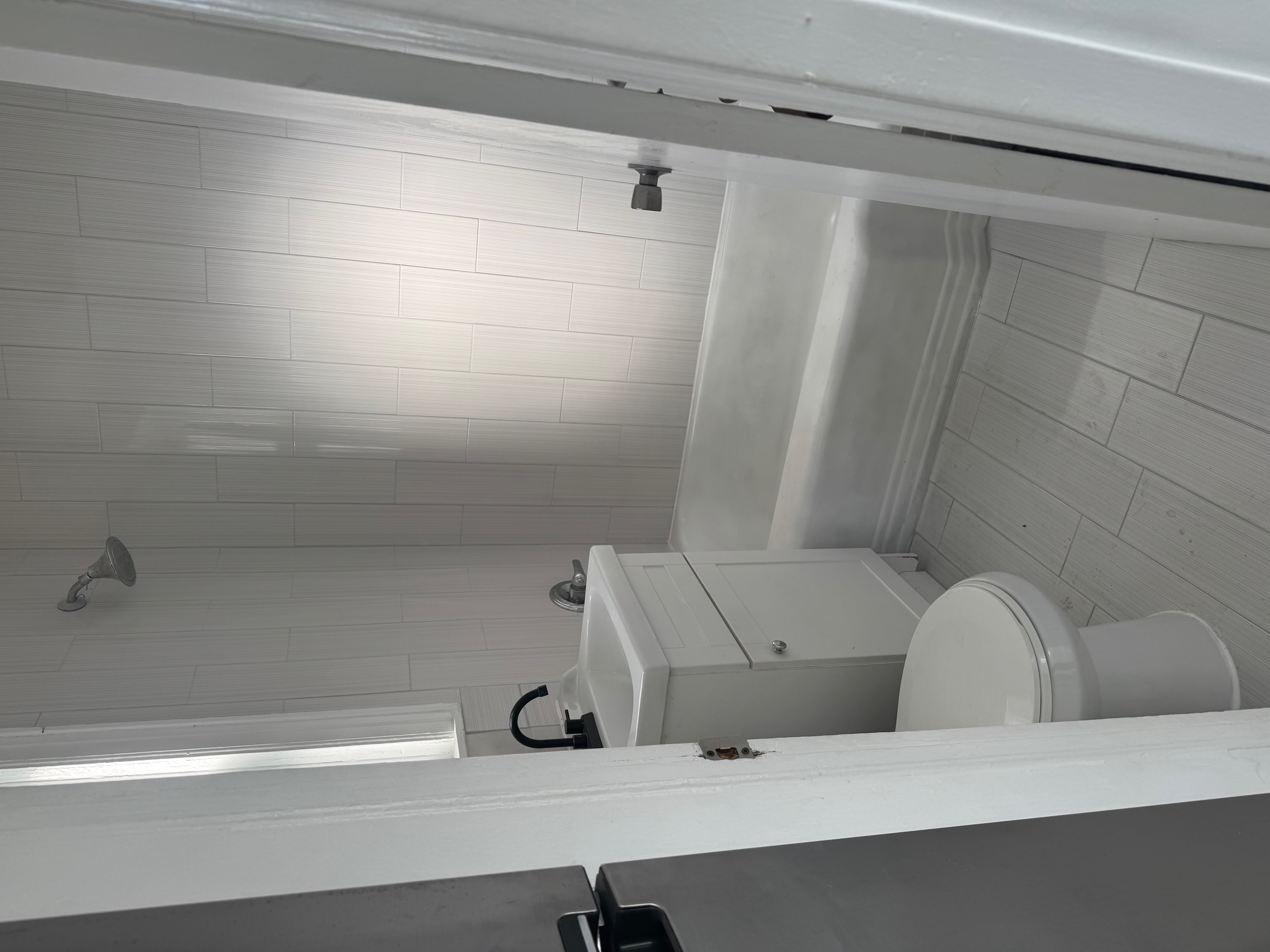 89-16 102nd Road, Unit 2 Queens, NY 11416 - Photo 2 of 13 a white bath tub sitting next to a white toilet