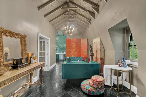 a spacious bathroom with a double vanity sink and a large mirror