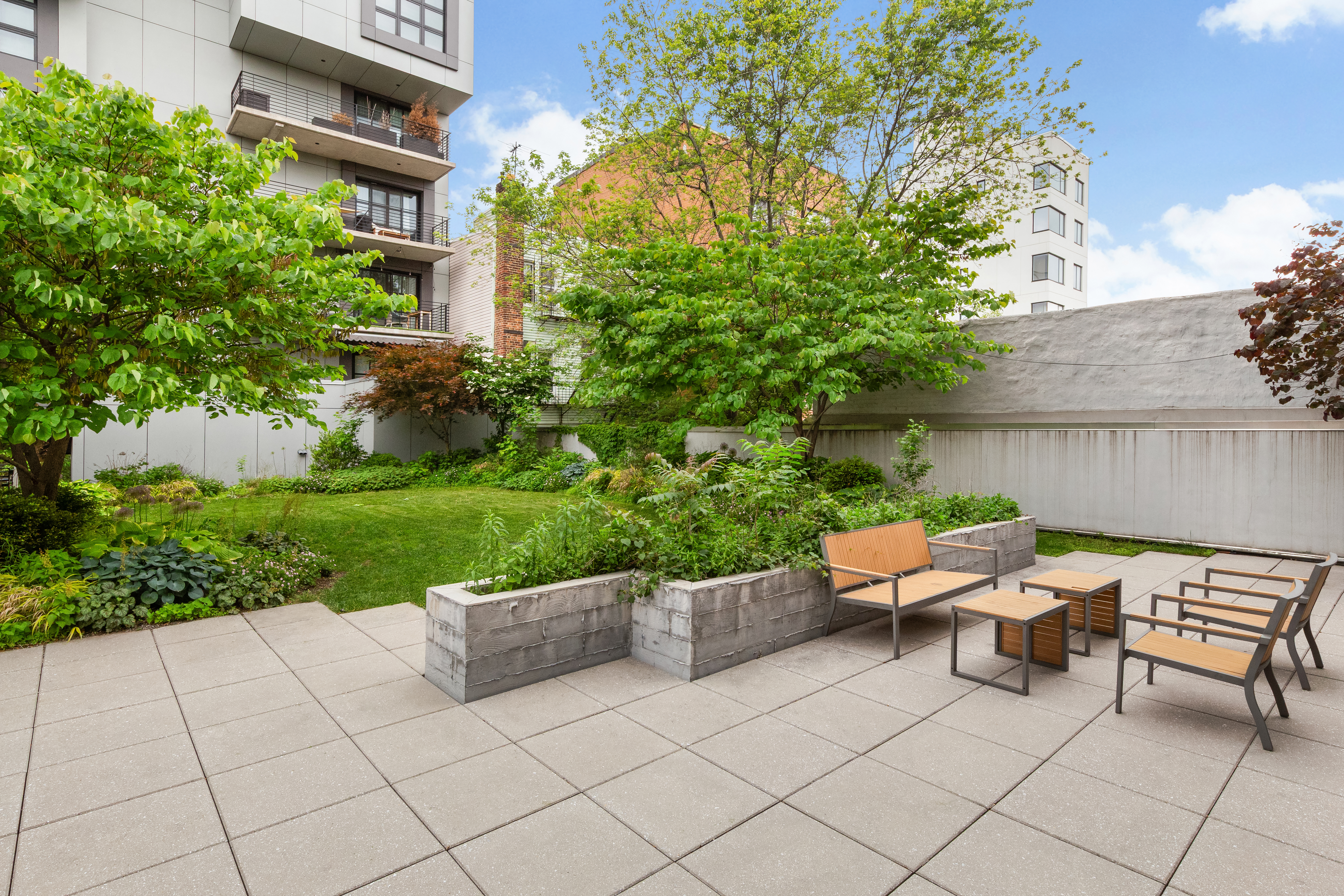 868 Lorimer Street, Unit 3C Brooklyn, NY 11222 - Photo 9 of 11 a backyard of a house with outdoor seating