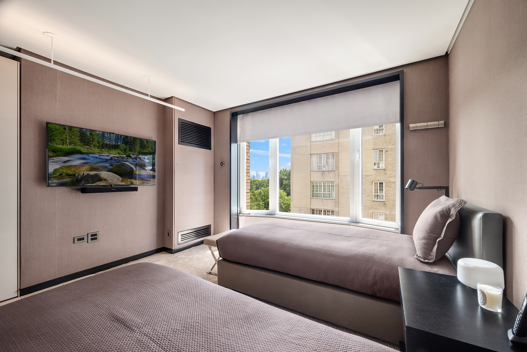 279 Central Park West, Unit 8B Manhattan, NY 10024 - Photo 9 of 15 a bedroom with a bed and a flat screen tv