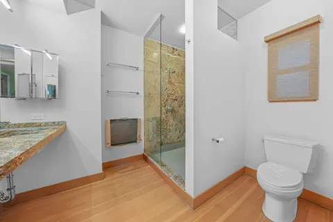 a bed room with furniture and a flat screen tv