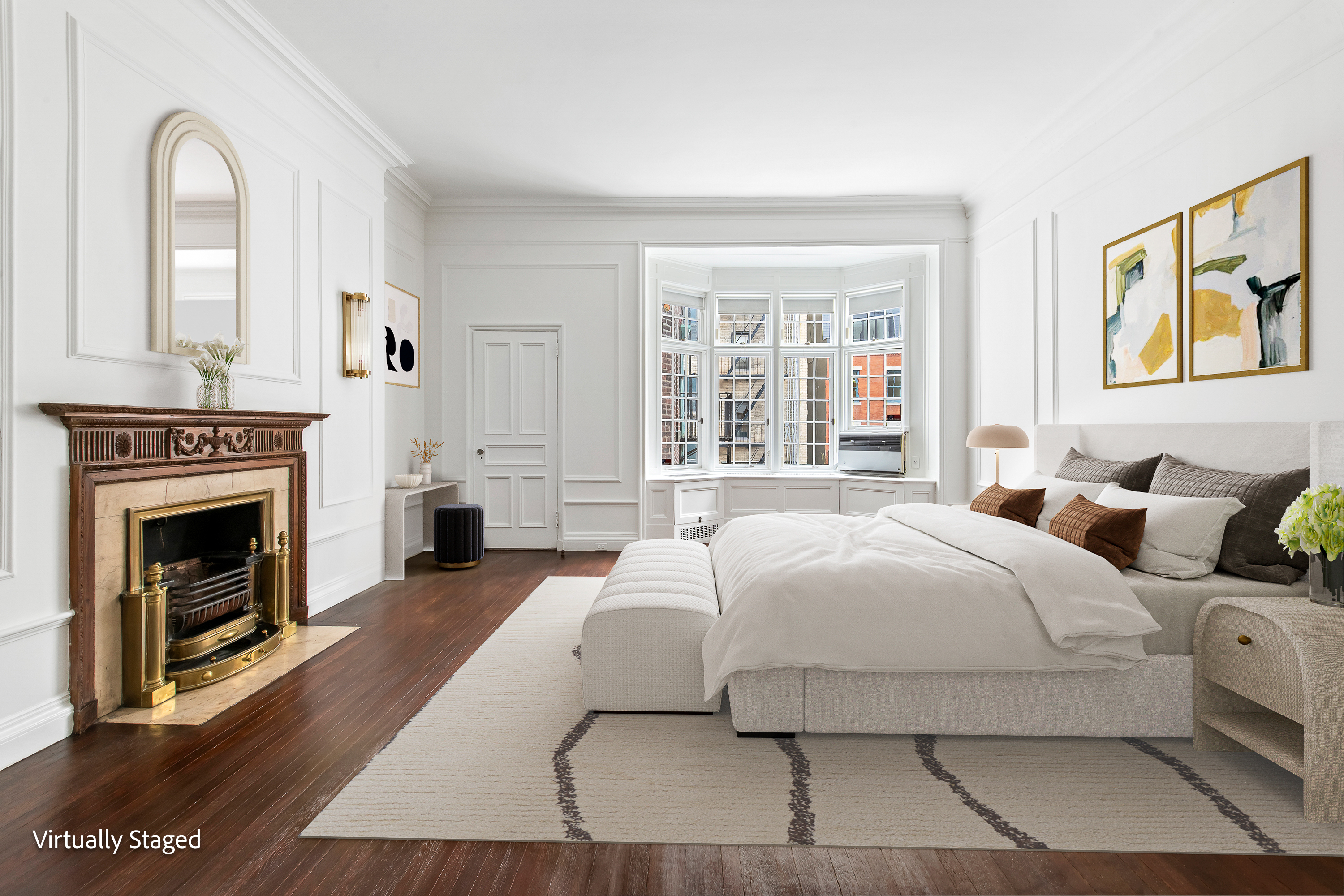 155 East 70th Street Manhattan, NY 10021 - Photo 12 of 27 a bedroom with a large bed and a fireplace